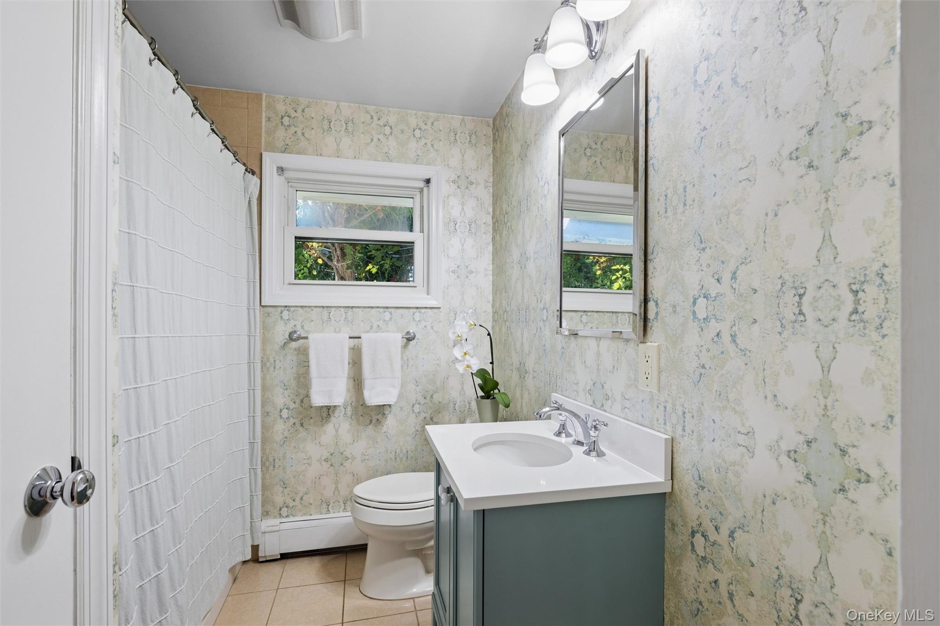 First level full bath with shower/tub and a custom vanity
