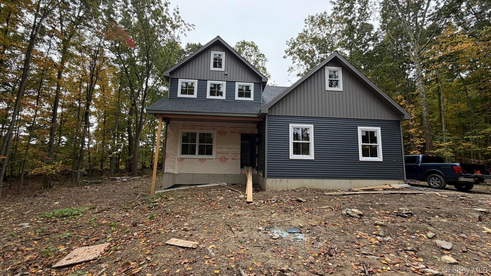 Construction Progress Photo of Exterior Siding Installation in Progress.