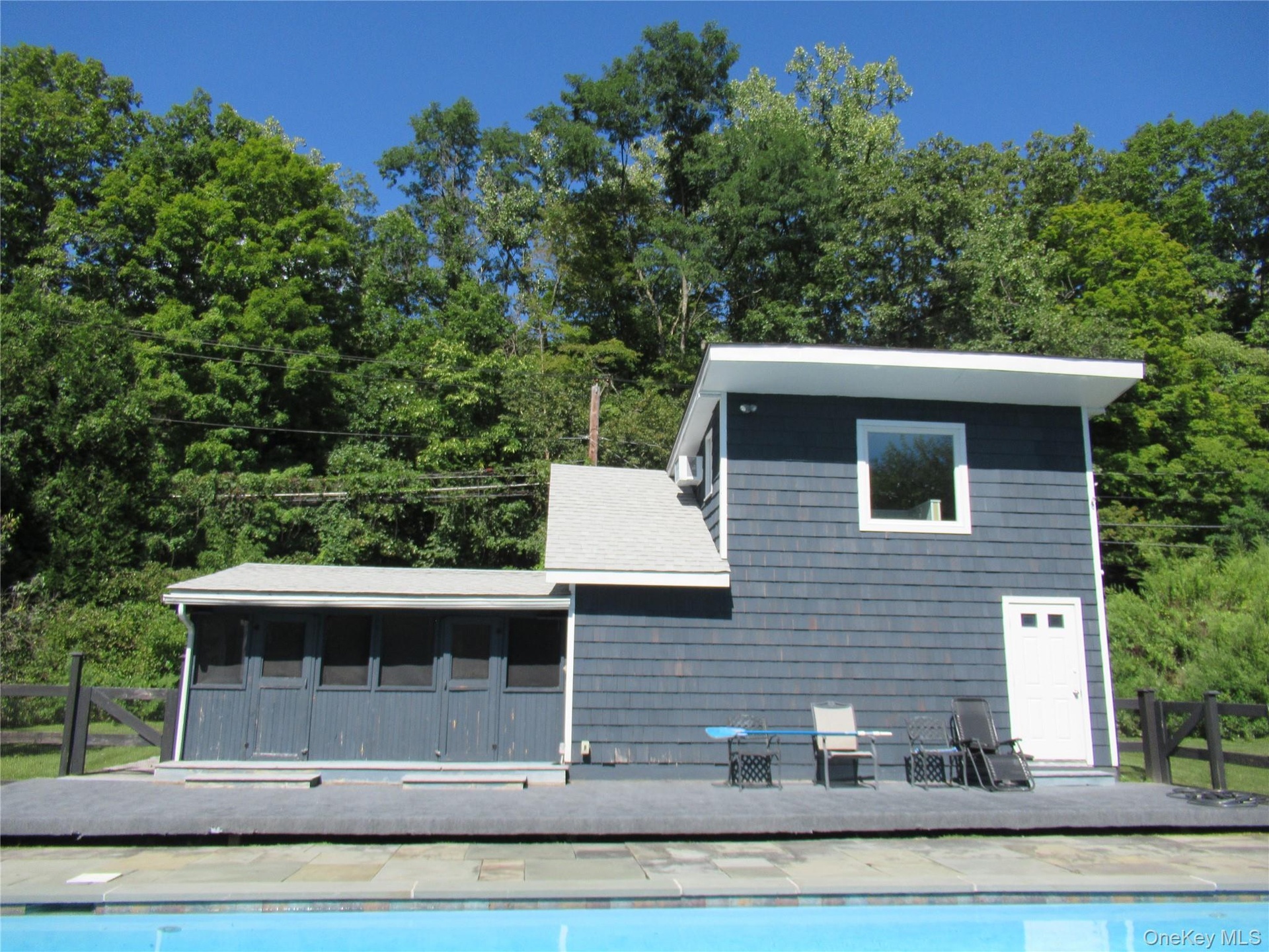 Opens up directly to fenced in pool area