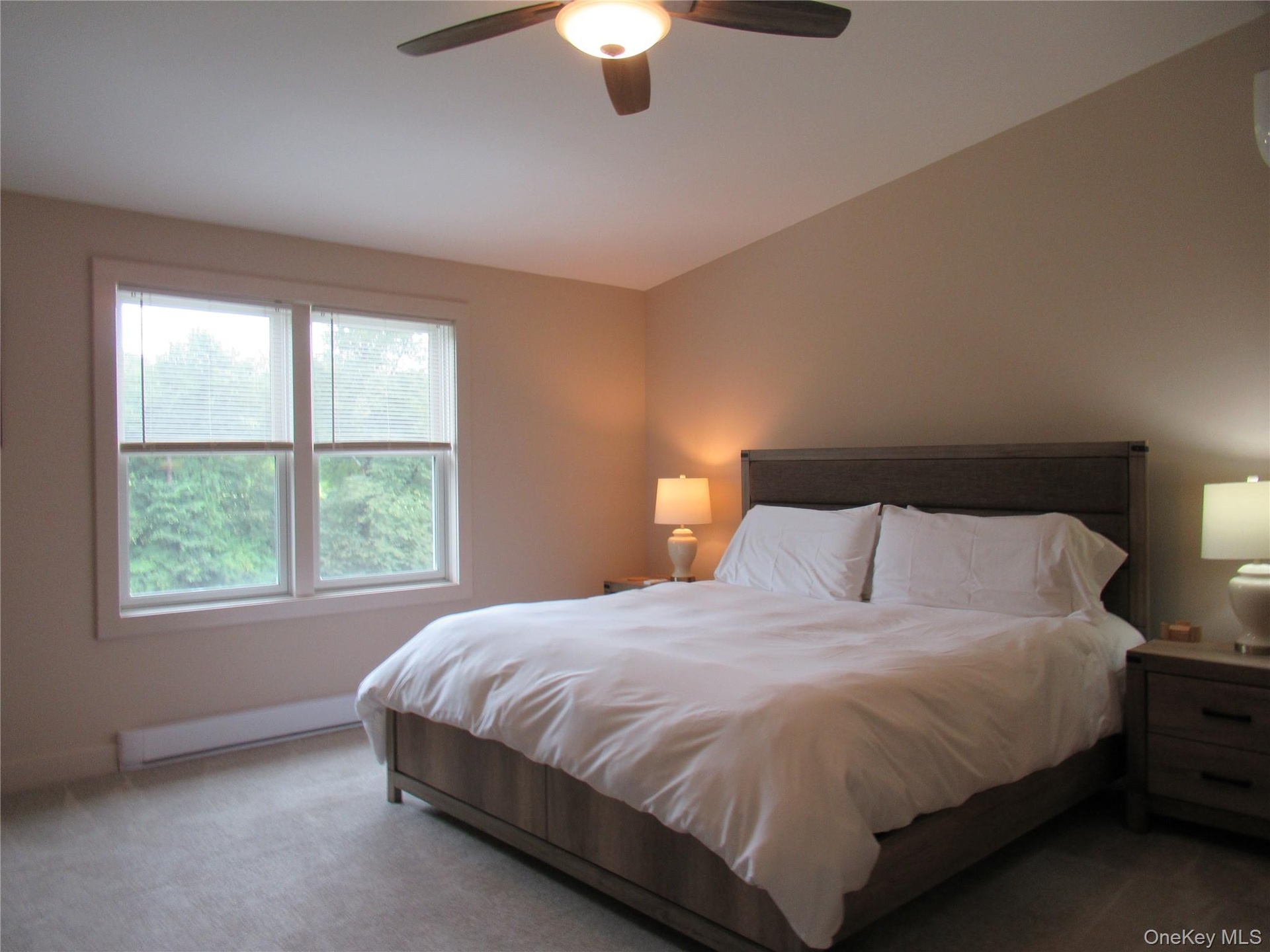 Main Bedroom with ceiling fan and river views