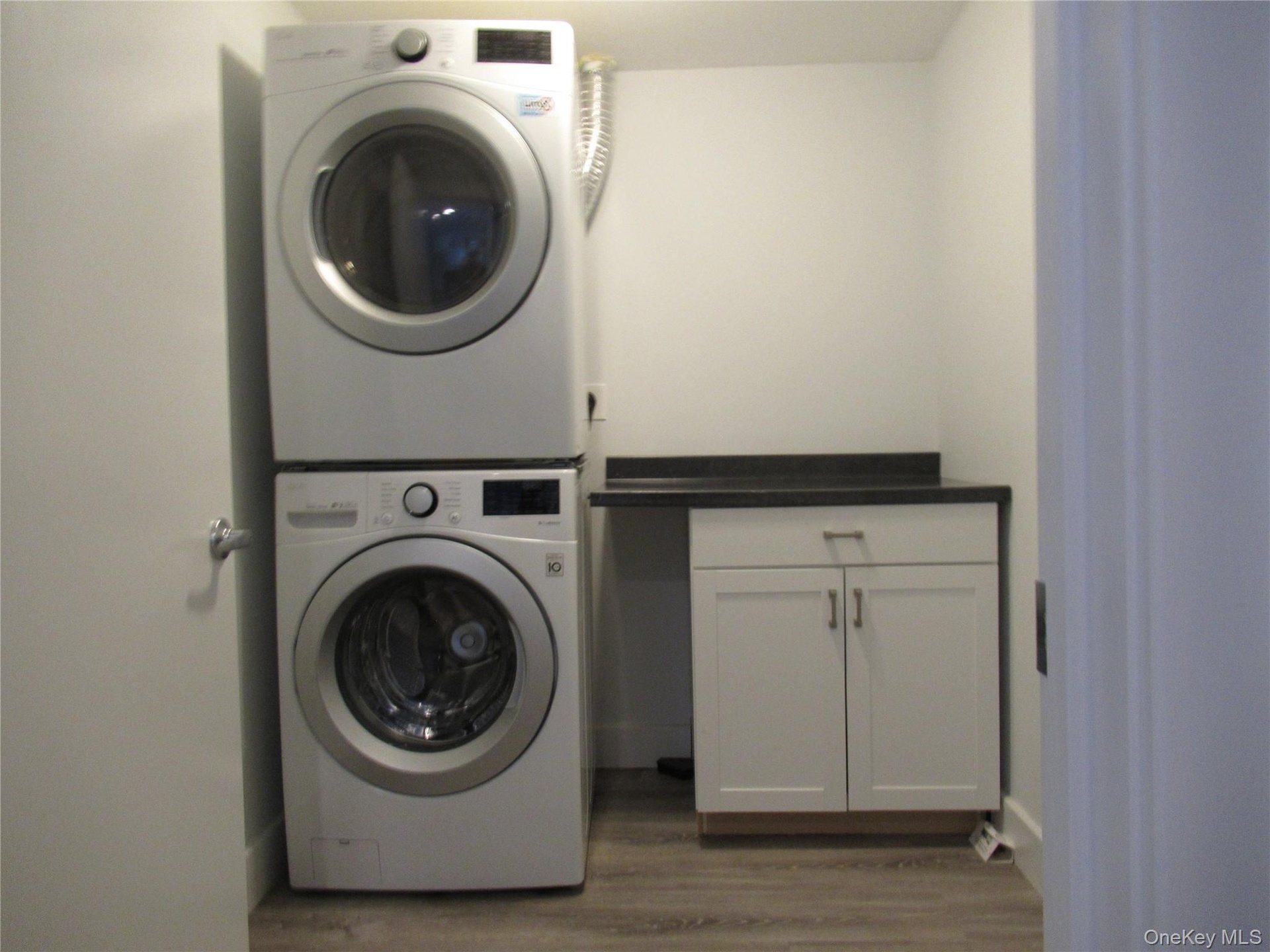 Laundry room with storage cabinet
