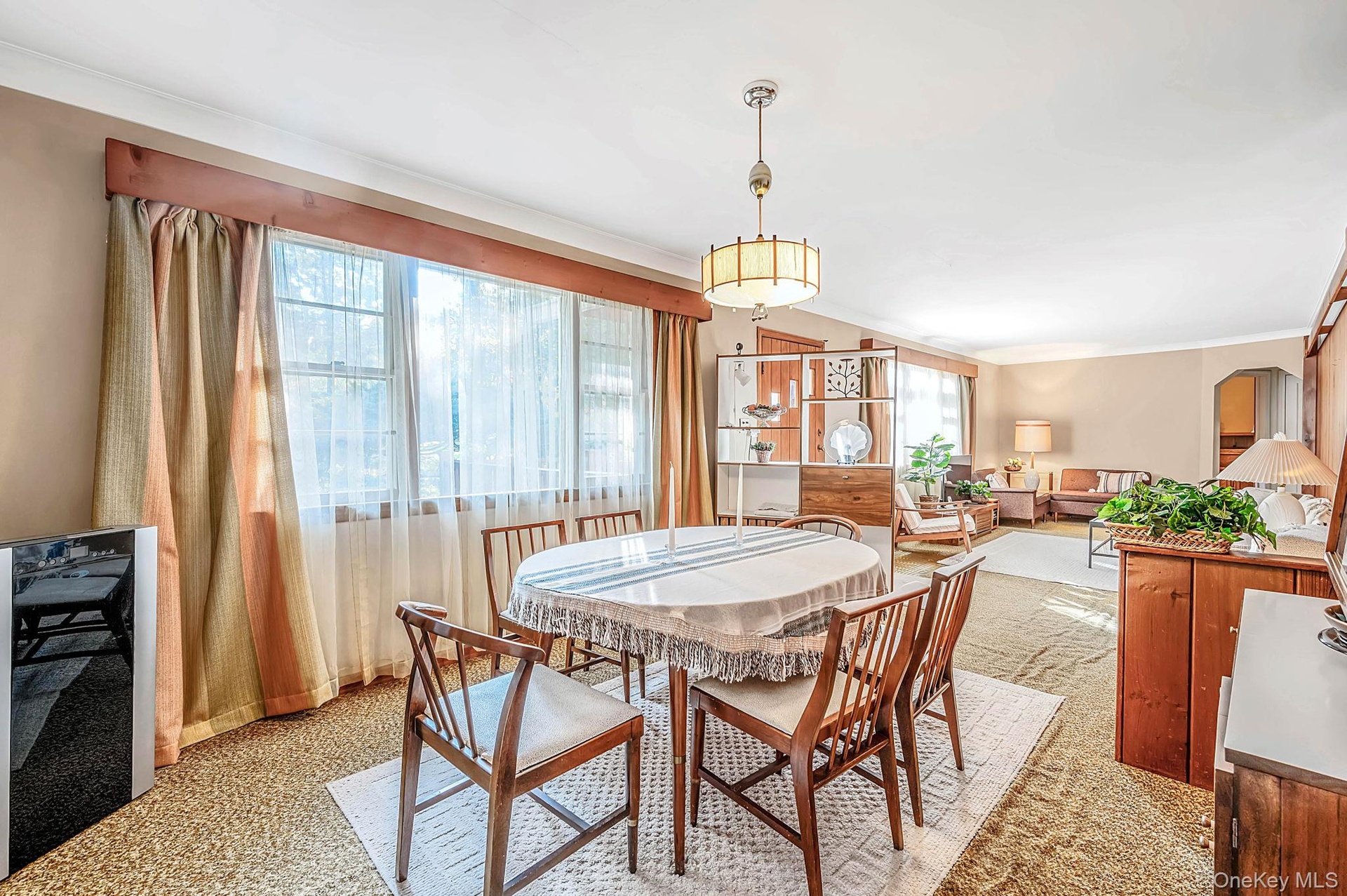 Bright dining area open to living room