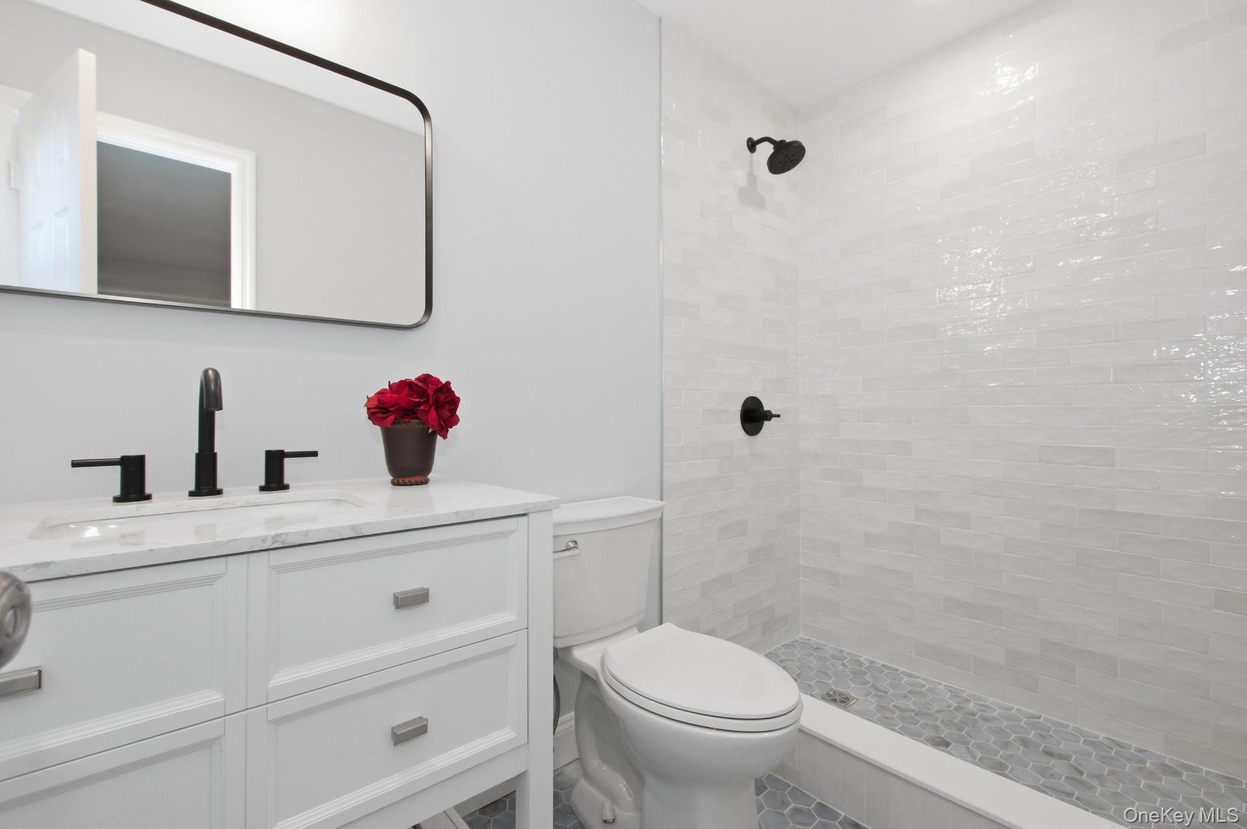 Primary Bathroom has beautiful tile for a calming spa like experience