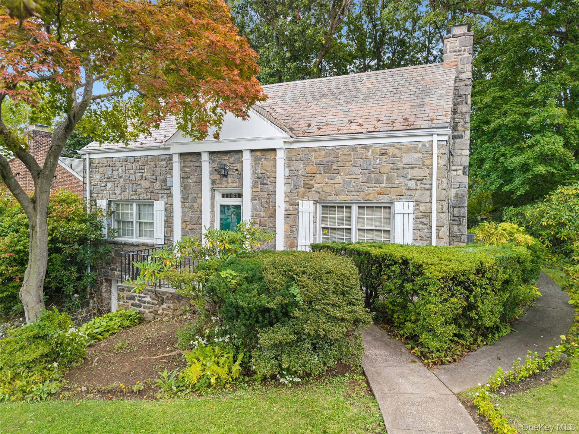 Welcome home to 28 Ritchie Drive, Yonkers - attractive stone home with classic slate room adds to home' curb appeal