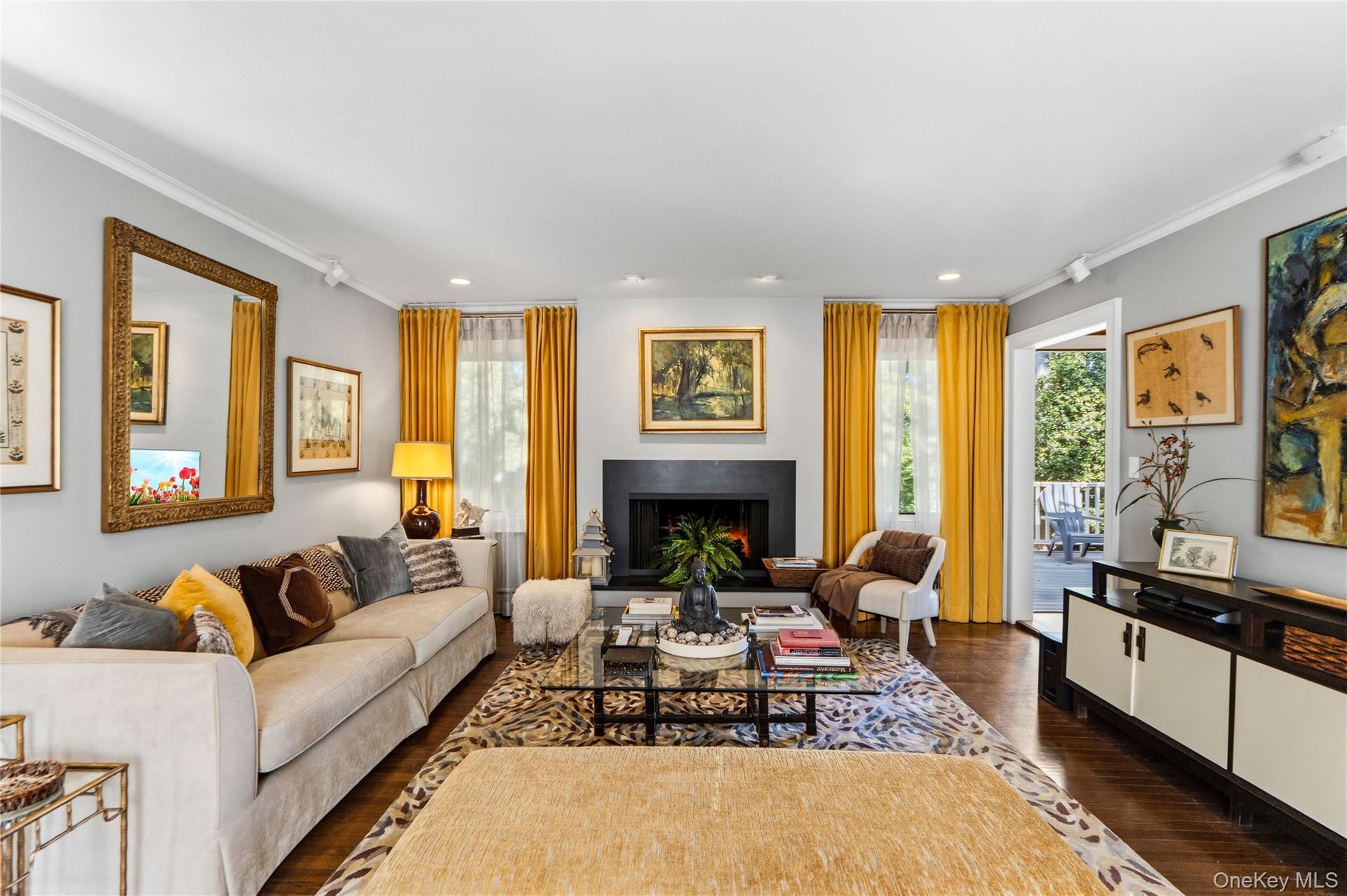 Living area featuring hardwood flooring, recessed lighting