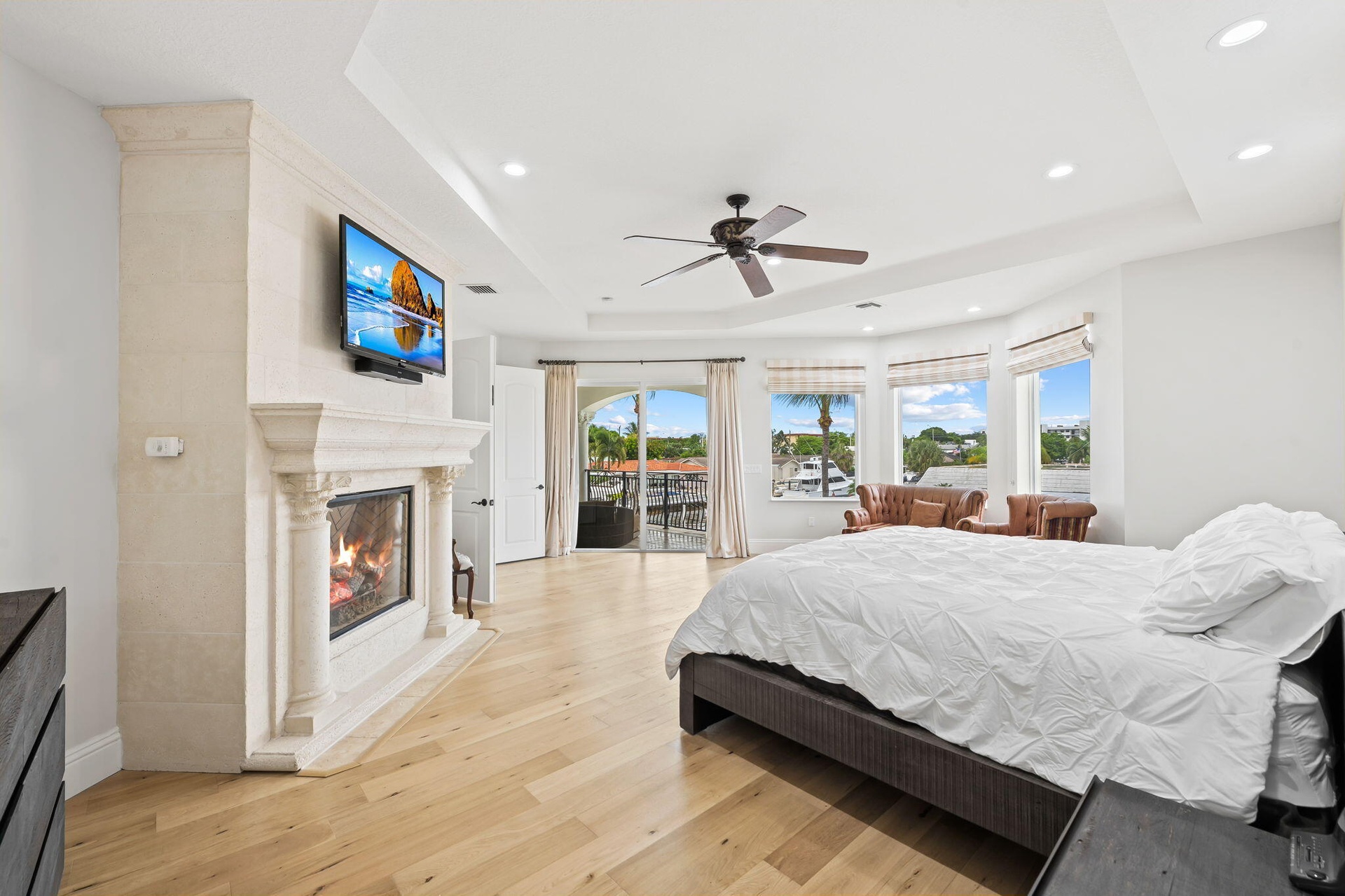 Large primary bedroom with gas fireplace and two sitting rooms