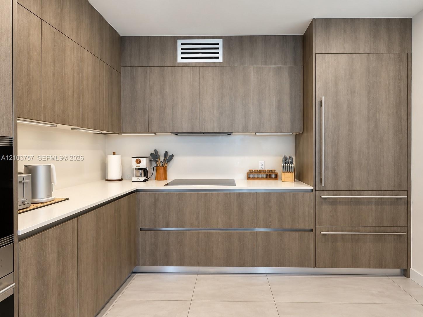 Integrated panel-ready refrigerator with stainless steel hardware