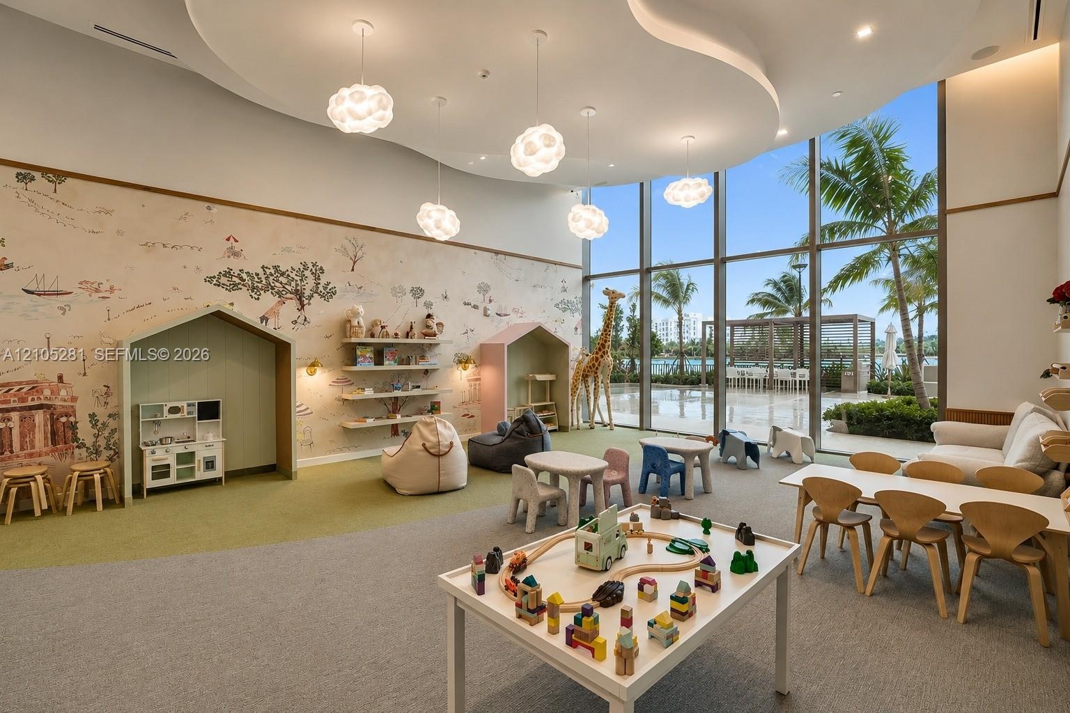 Expansive room featuring floor-to-ceiling windows, custom tray ceiling, integrated spherical pendant lighting, and built-in wall niches