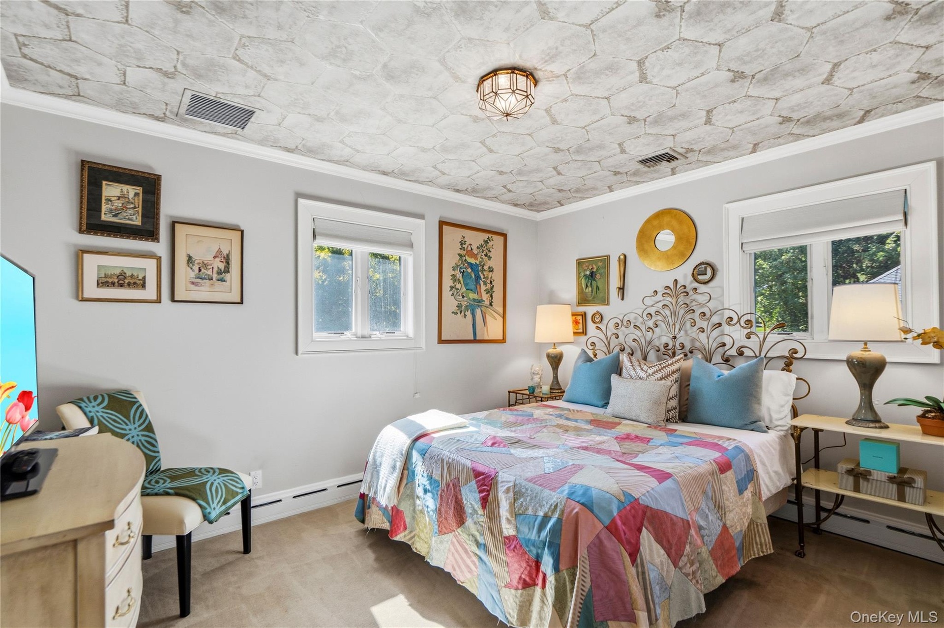 First Floor Bedroom with Distinctive hexagonal patterned ceiling treatment, dual windows with crisp white casing, and a central flush-mount geometric 