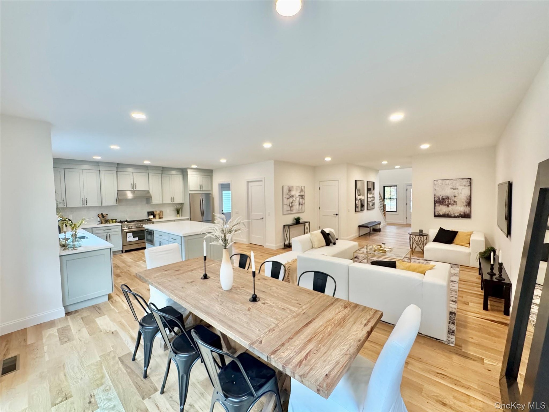 Dining space featuring recessed lighting and light wood-style flooring