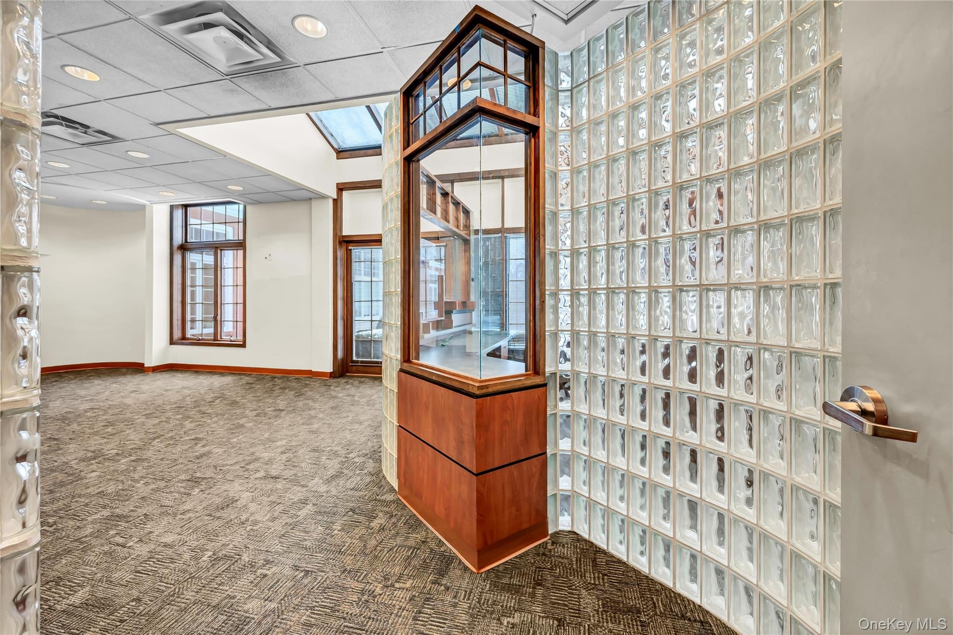 Welcome area featuring a drop ceiling