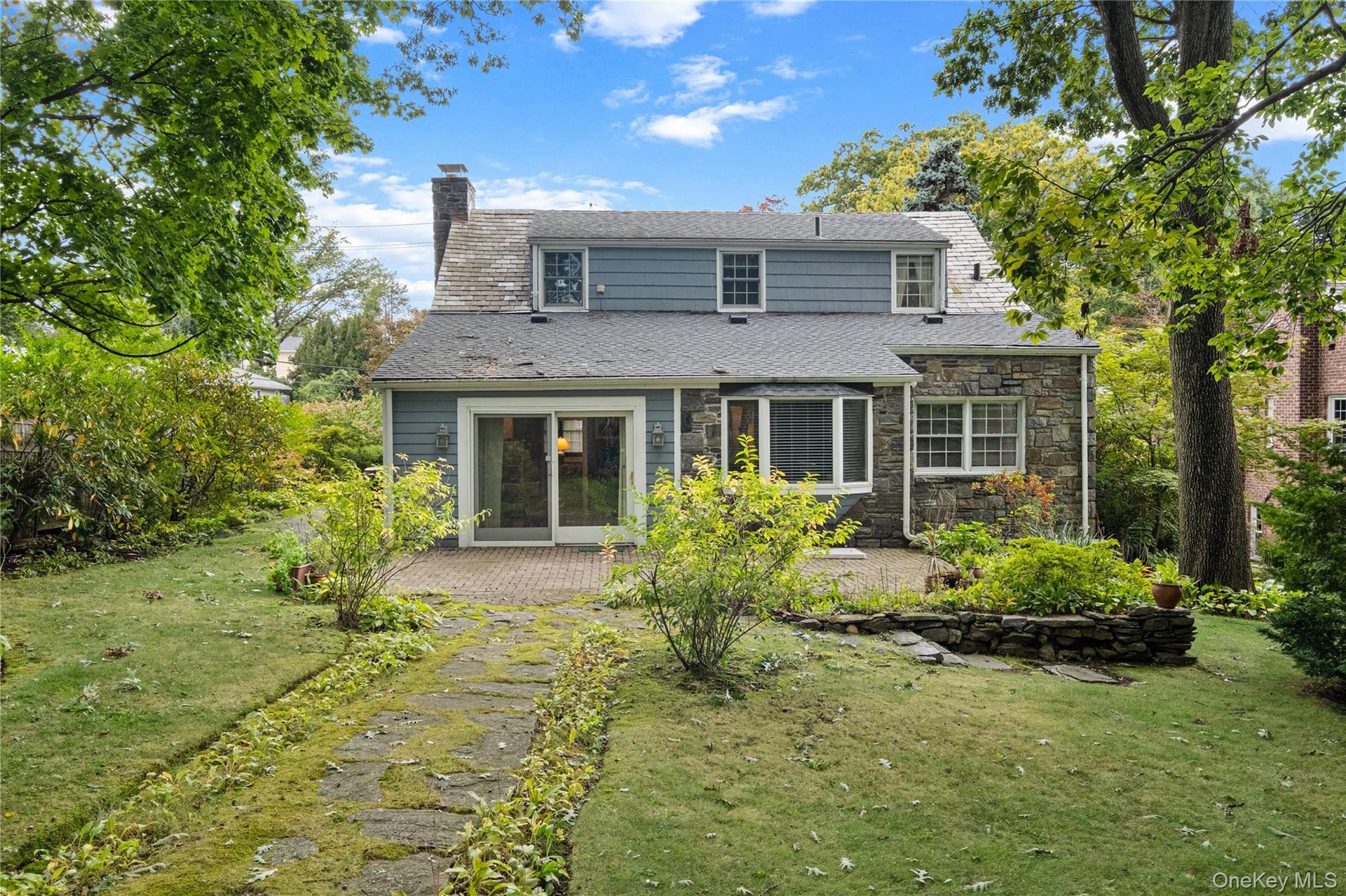 Patio and grassy yard