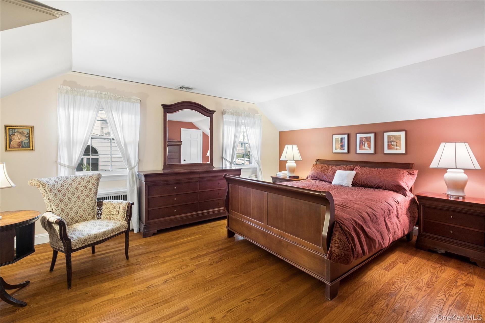 Large and inviting primary bedroom with large closets