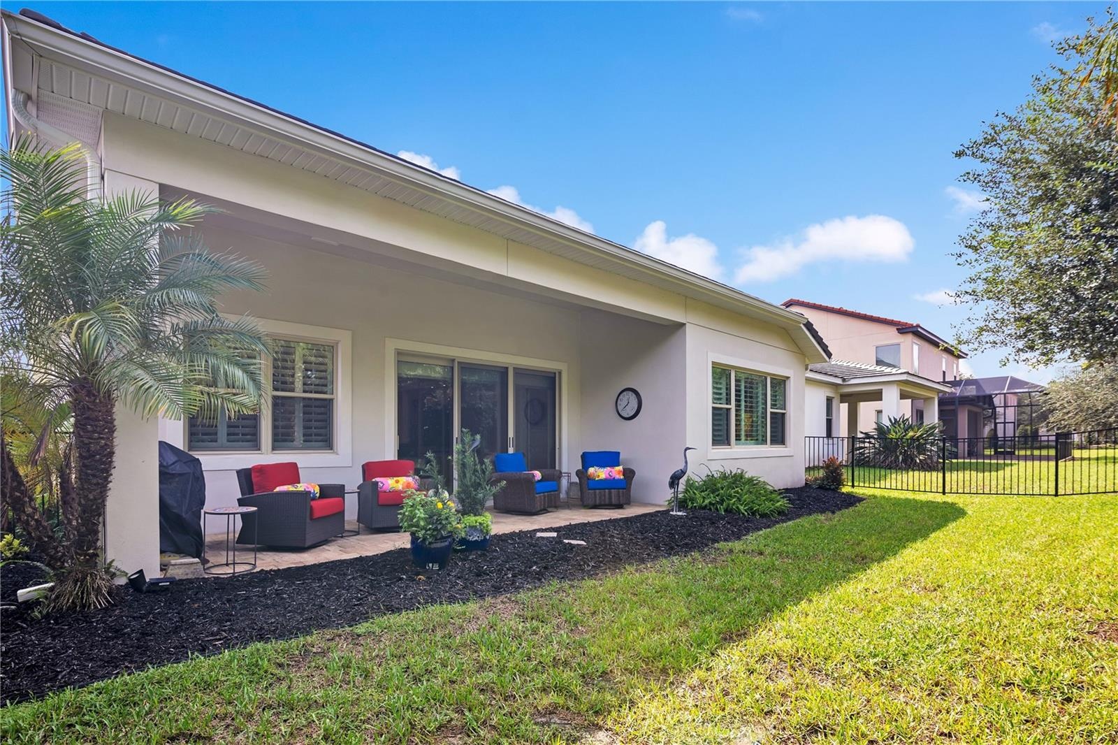 Enjoy Florida living from the covered patio, ideal for outdoor dining and relaxation.