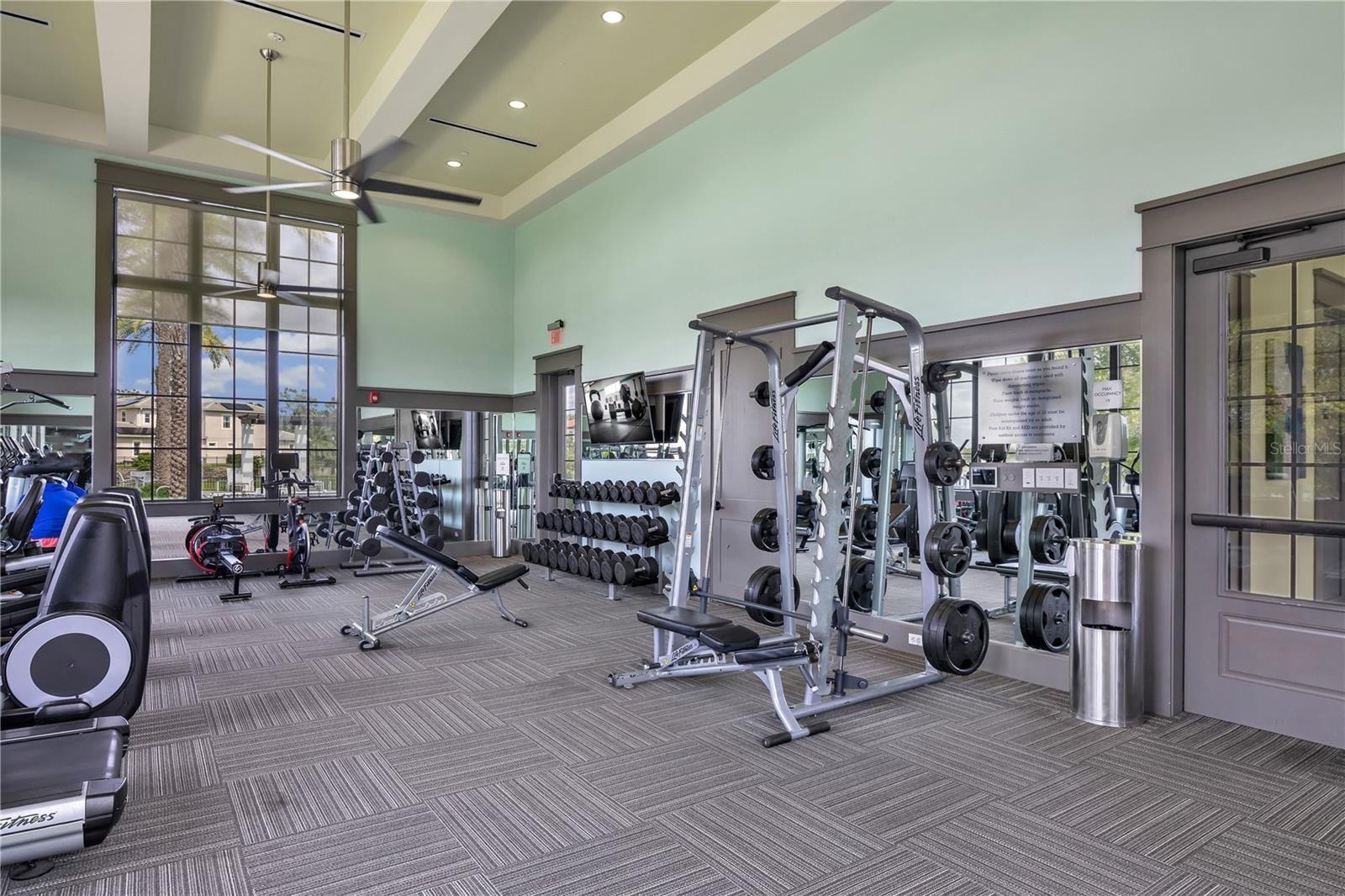 Additional view of the community fitness center and exercise equipment.