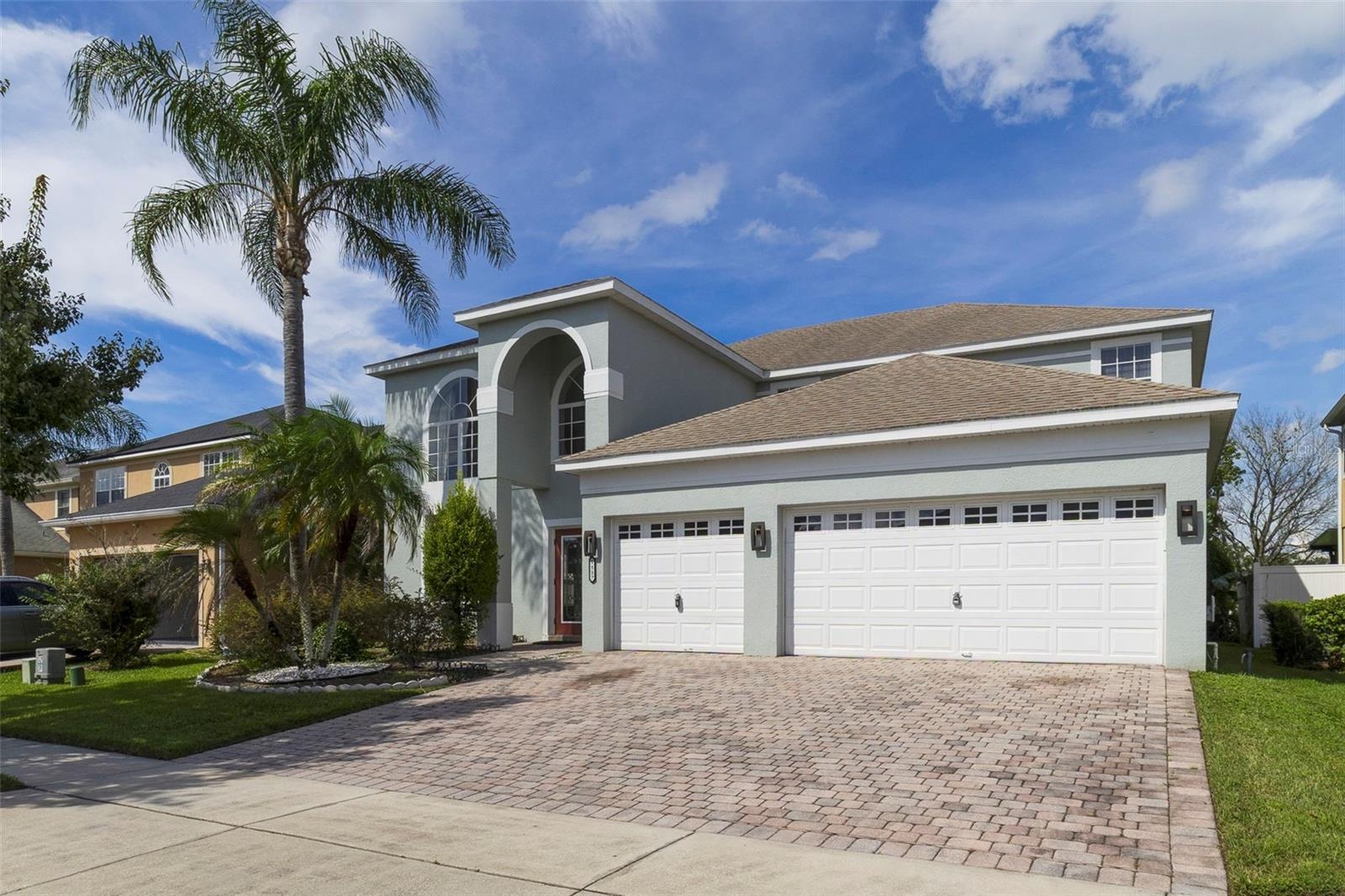 With a SCENIC POND VIEW from the front, attractive landscaping and a brick-paver driveway leading to the THREE-CAR GARAGE, this home makes a wonderful