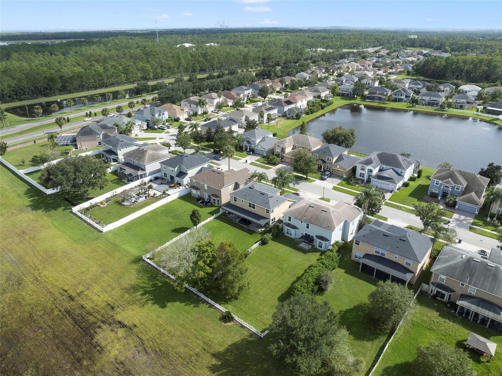 Aerial view of the back of the home and community.