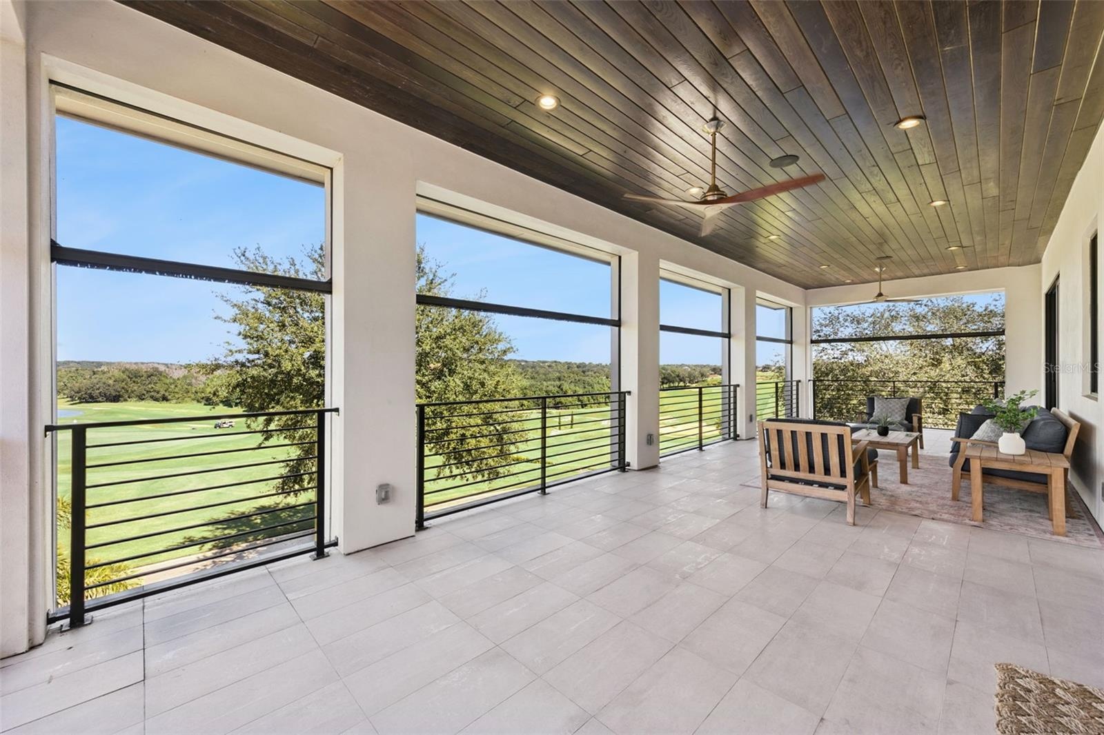 Balcony from primary bedroom, with retractable screens.