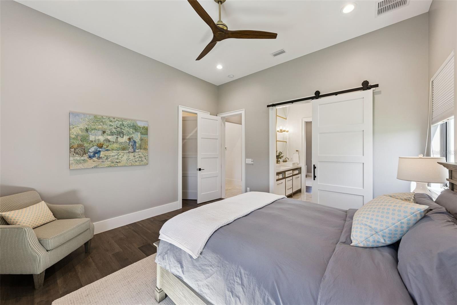Primary bedroom with balcony access