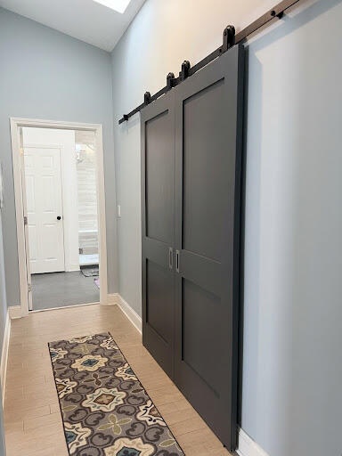 Walk-in closet is behind the barn door