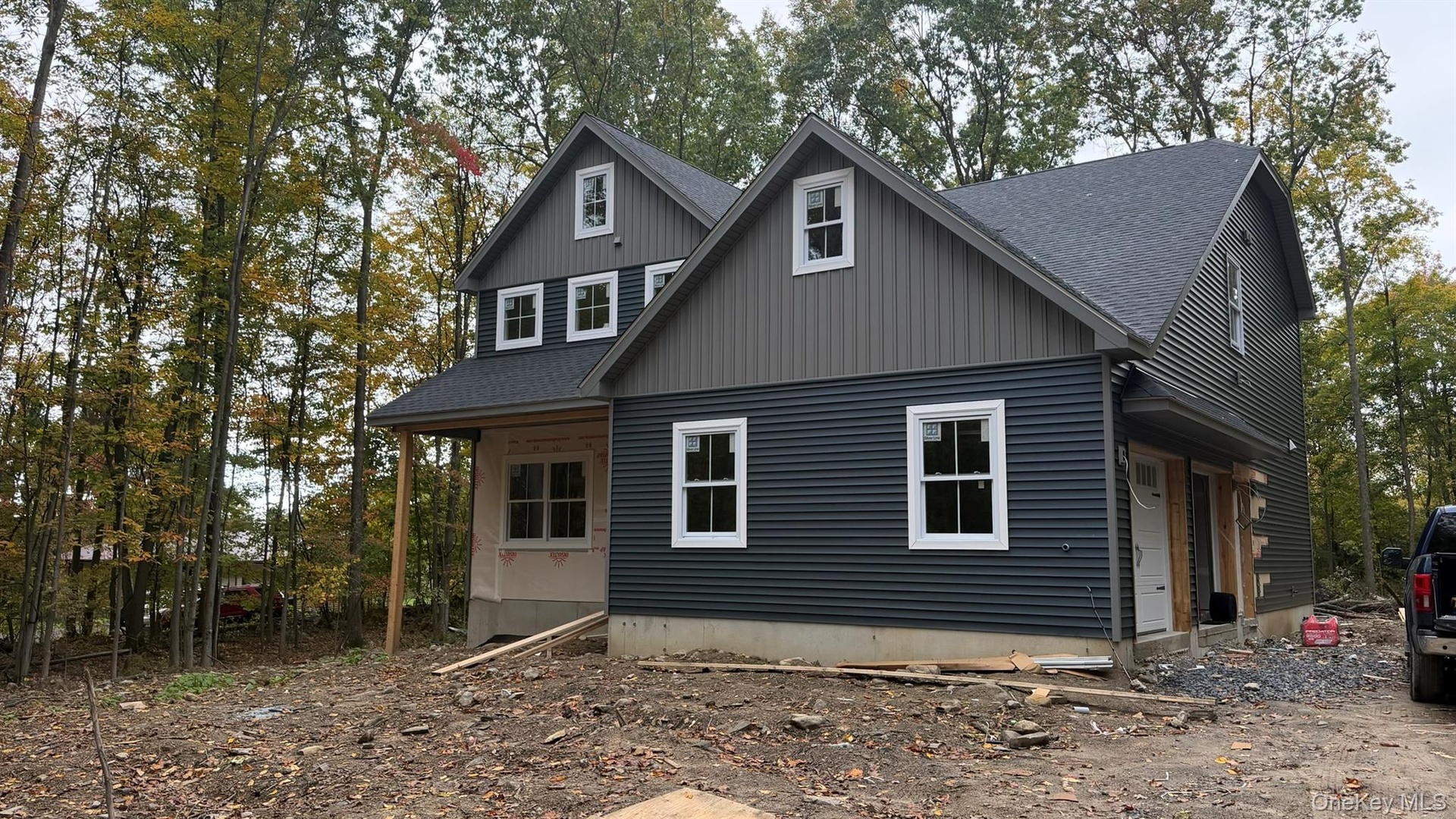Construction Progress Photo of Exterior Siding Installation in Progress.