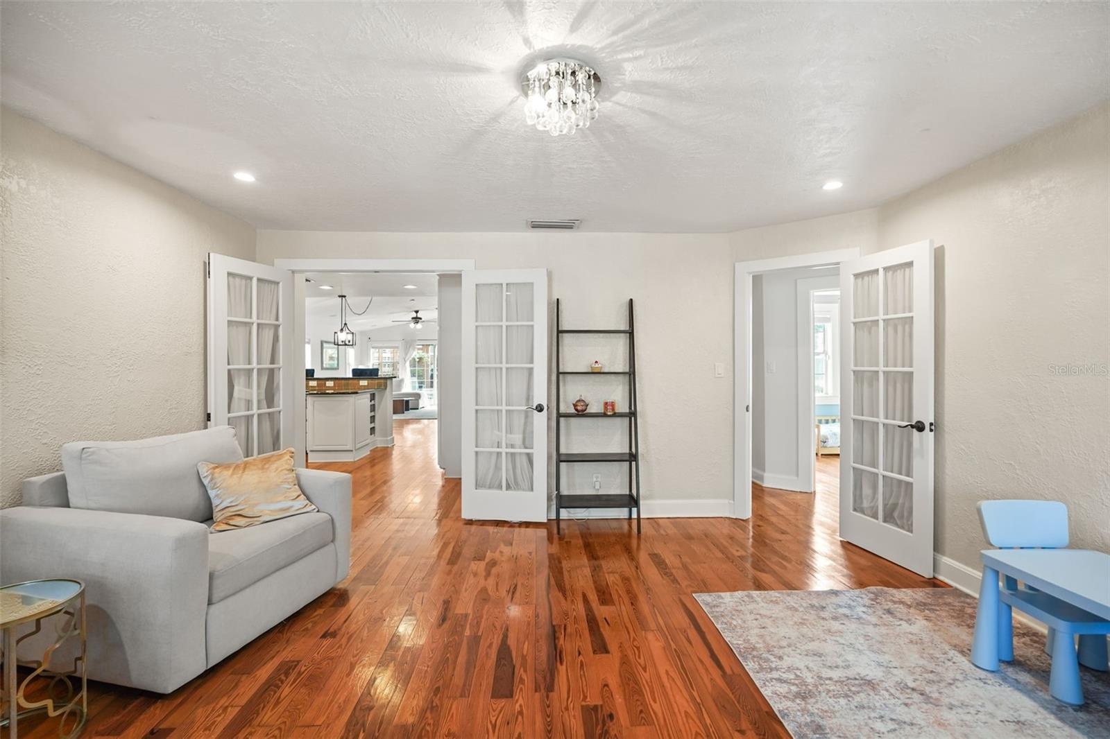Front family room with French doors opening to the kitchen