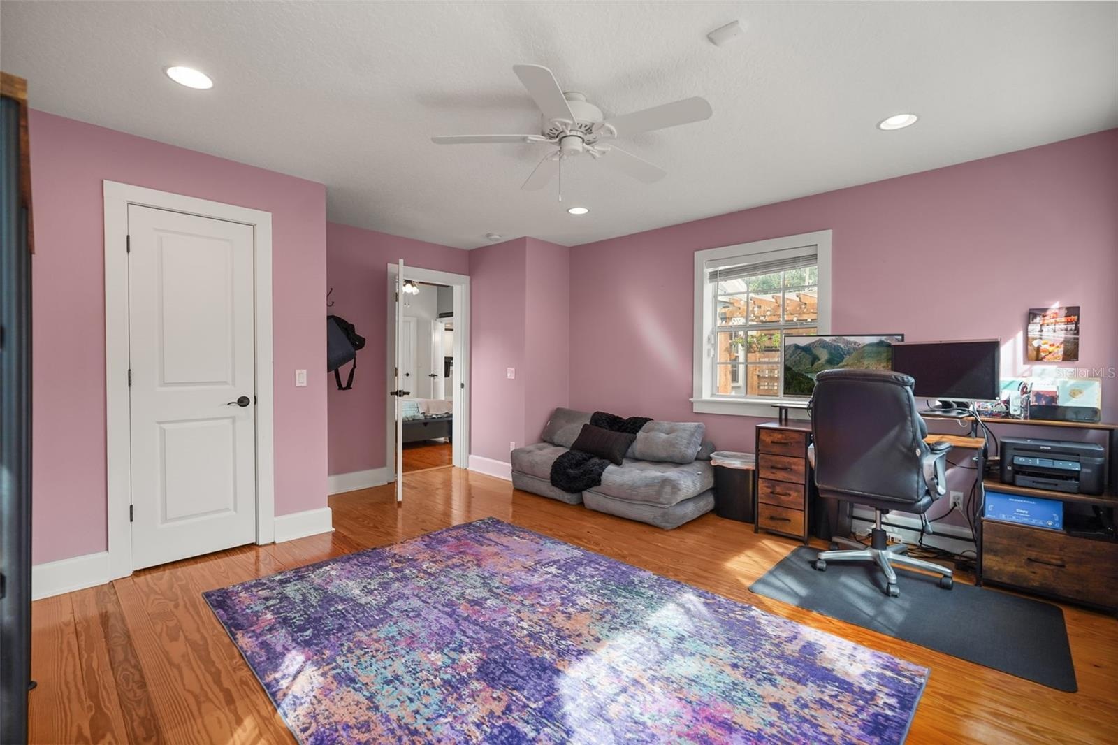 Study with closet and wood floors