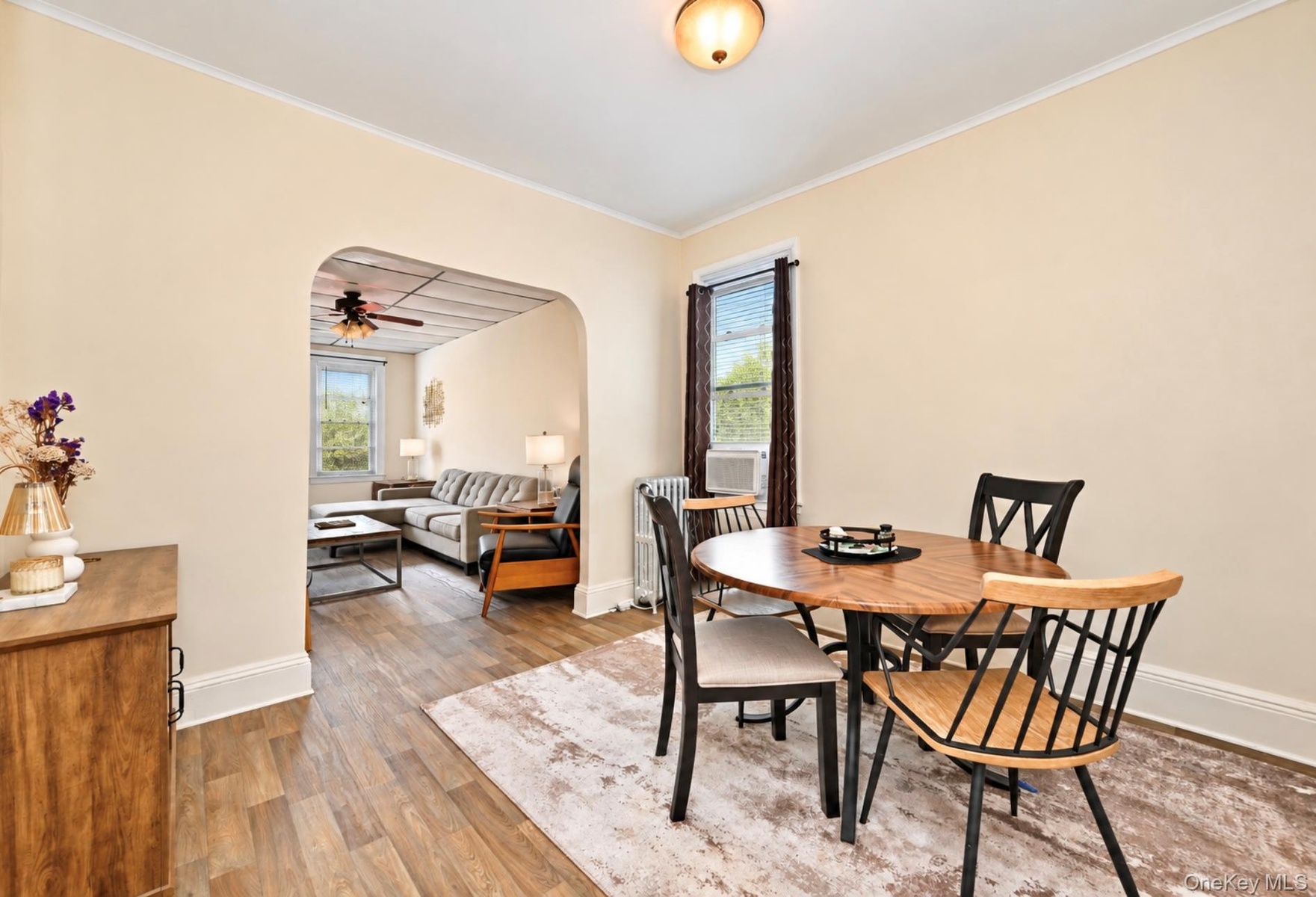 2nd. Floor:  Arched doorway, wood-finish flooring, and flush-mount ceiling lighting