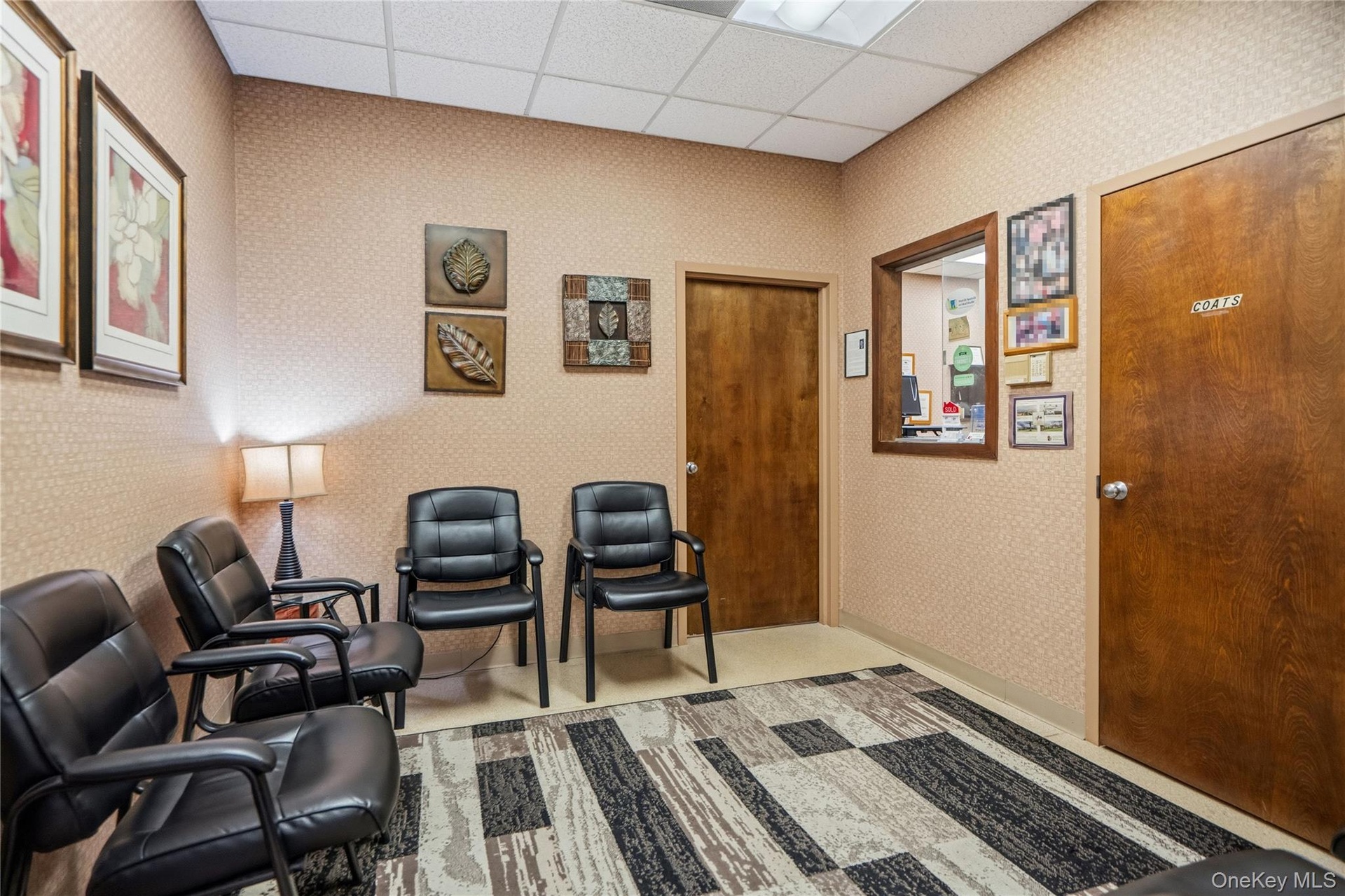 Drop ceiling featuring inset lighting, solid wood doors, and an interior pass-through window with wood casing
