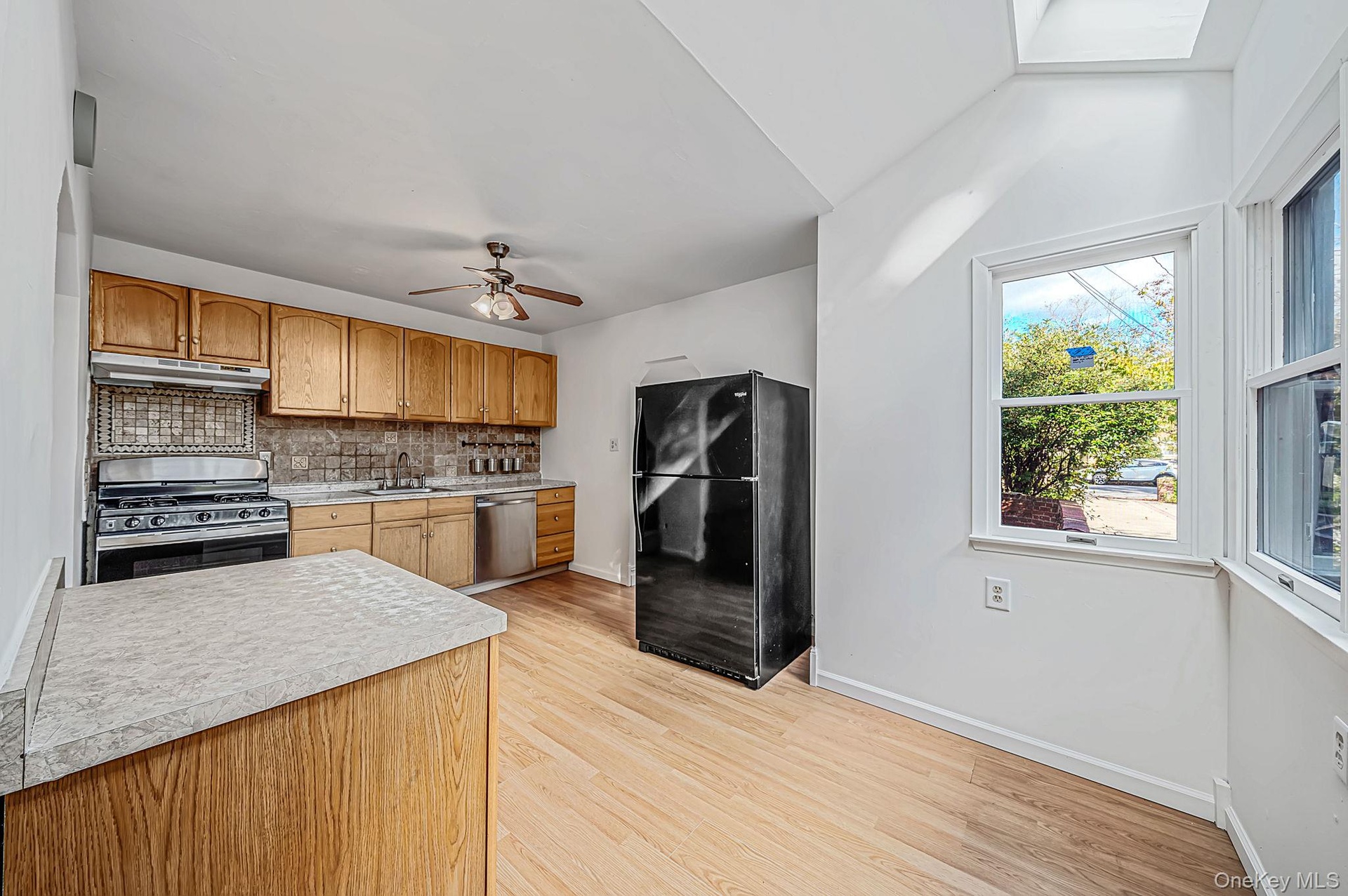 Alternate view of Kitchen. Skylights provide an abundance of natural light.