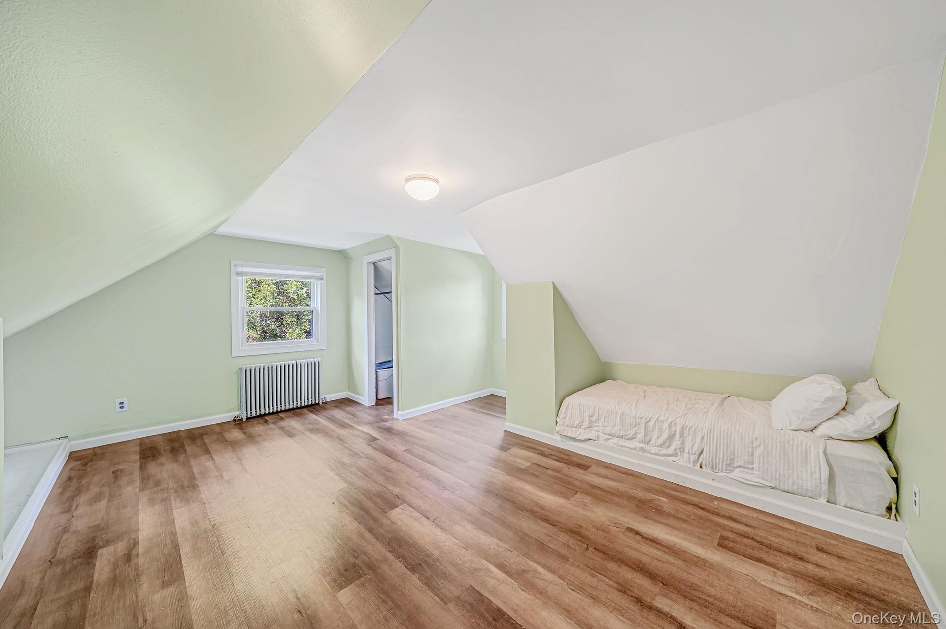 2nd Floor bedroom featuring laminate flooring, built in bed nook and doggie dormer