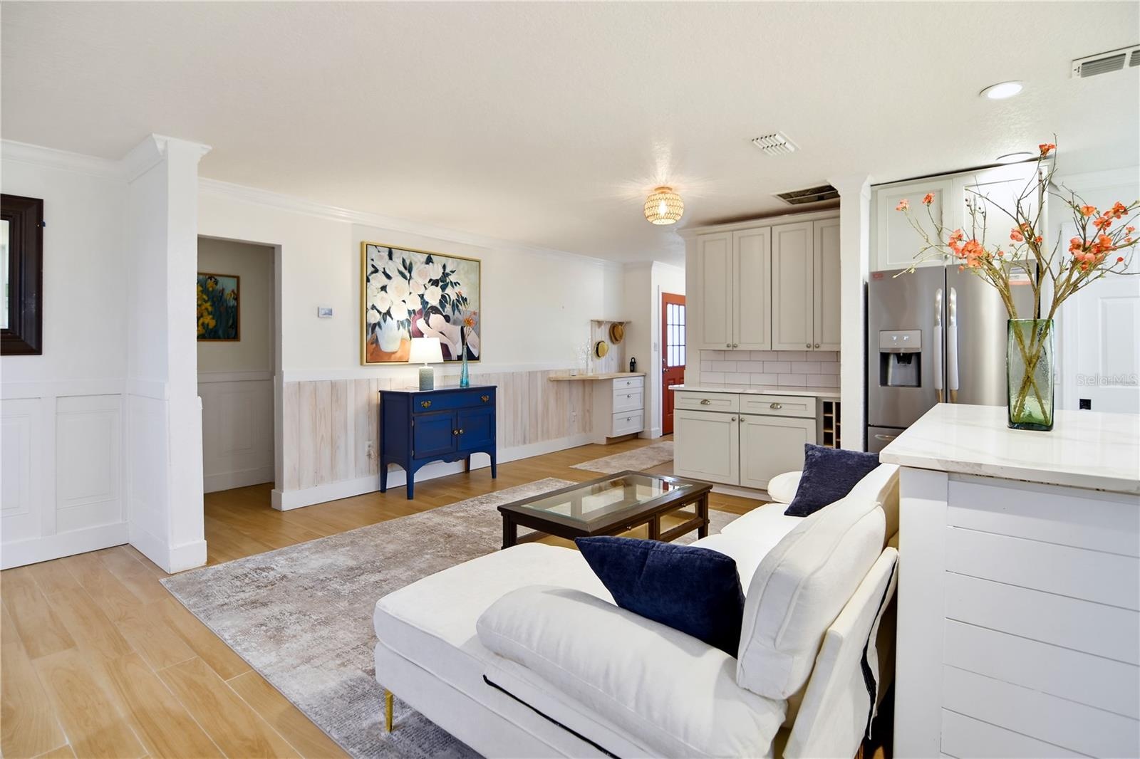 Expansive family room featuring a stone fireplace, built-in cabinetry, and generous seating space.
