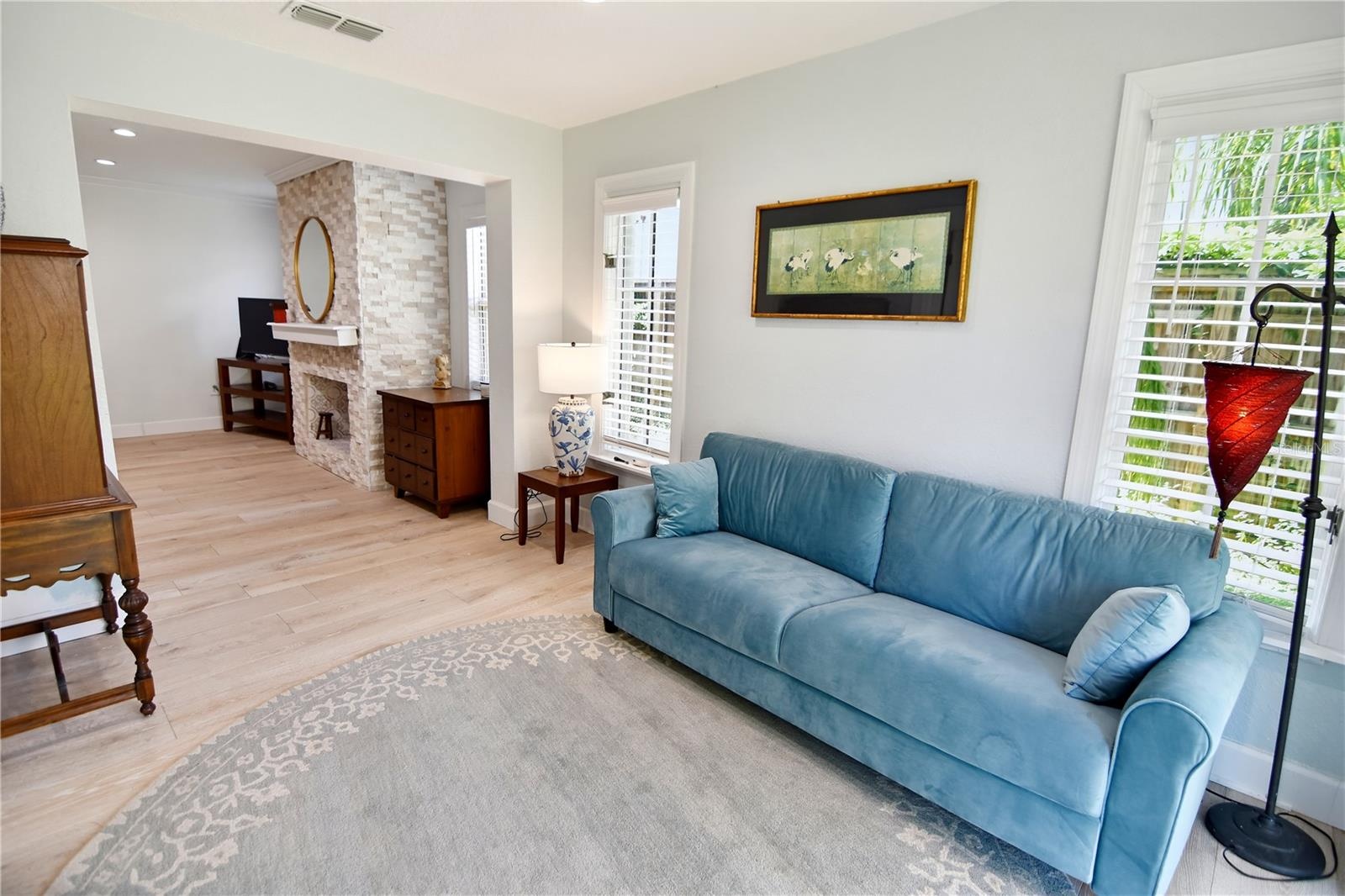 Light-filled sitting room provides a comfortable retreat overlooking the outdoor space.