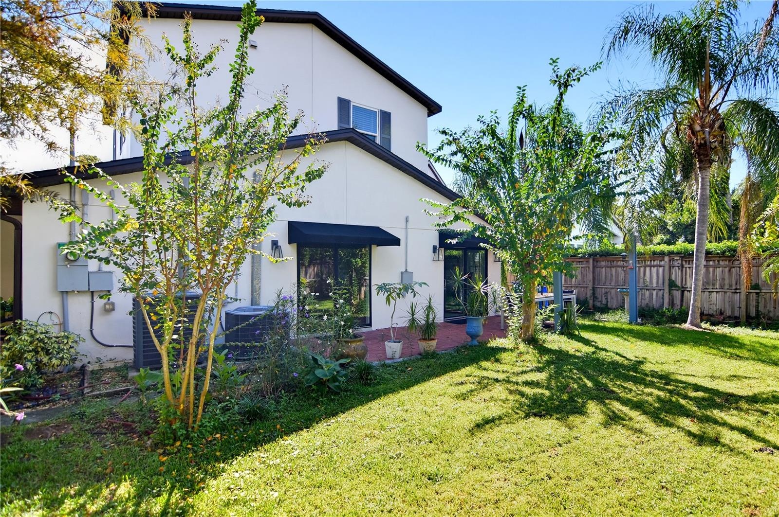 Another backyard perspective highlighting the landscaped grounds and outdoor living space.