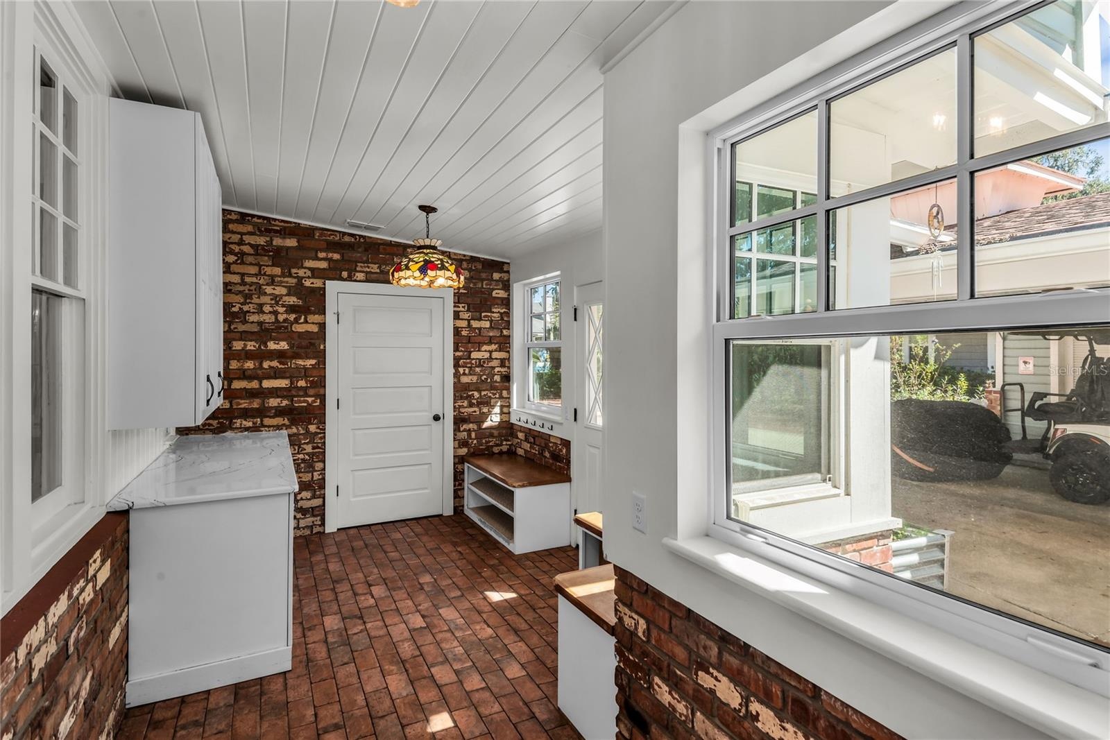Spacious Mudroom provides entry to carport while a granite countertop, cabinets and a large closet offer both convenience and functionality