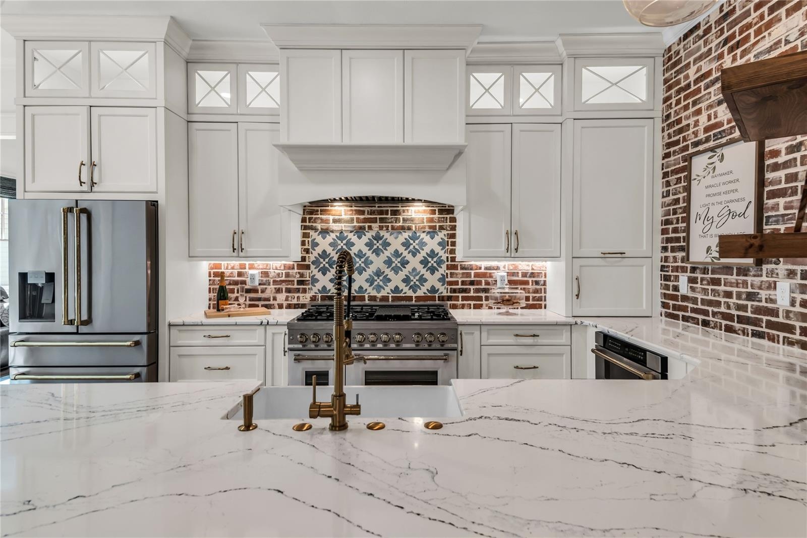 The chef's kitchen is a true focal point with a distinctive mix of old-world charm and modern design that combine luxury and function