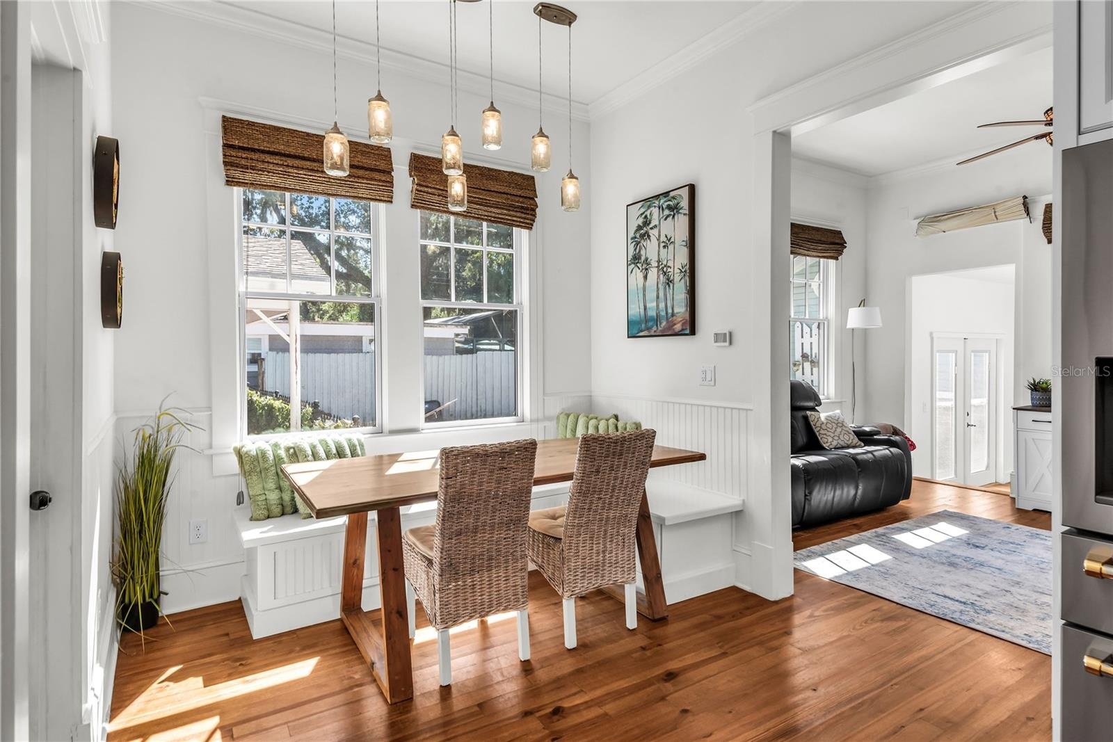 Bright and cozy breakfast nook with built-in seating