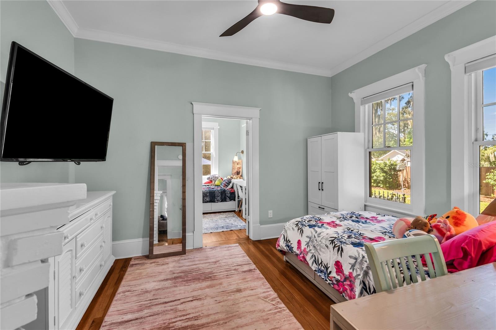 Bedroom 3 with original decorative fireplace