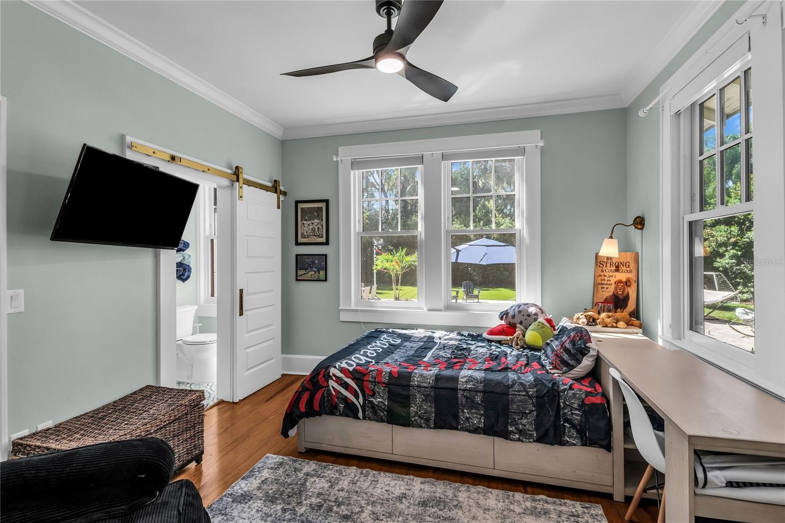 Bedroom 4 overlooks pool with ensuite bath