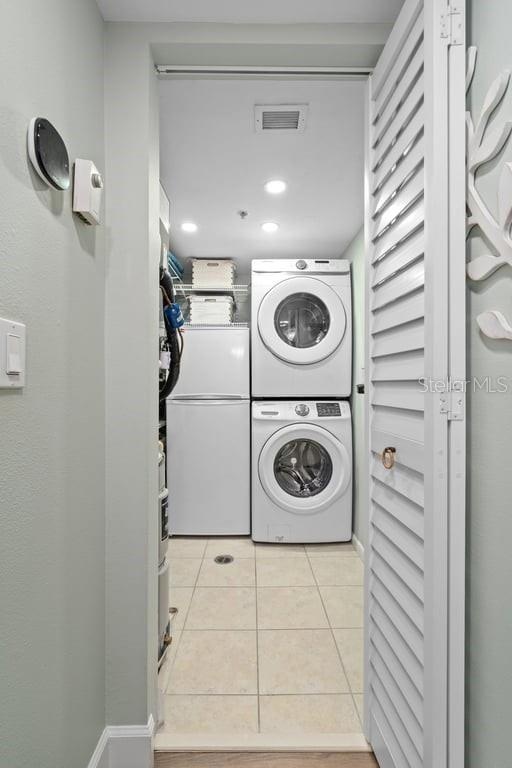 Laundry room with extra refrigerator.