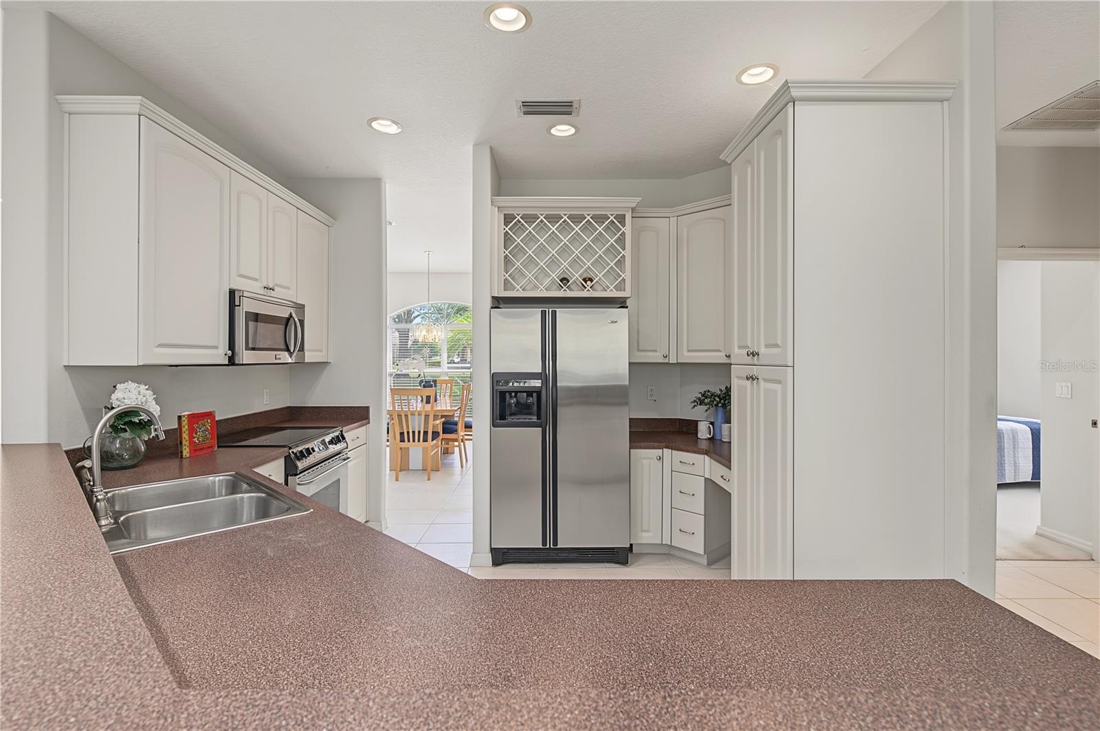 Open Kitchen to the Living Room and Family Room, stainless steel appliances.
