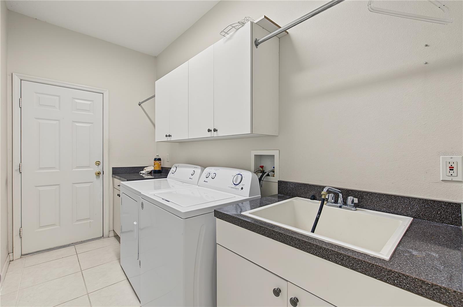 Laundry room and sink coming in from the garage.