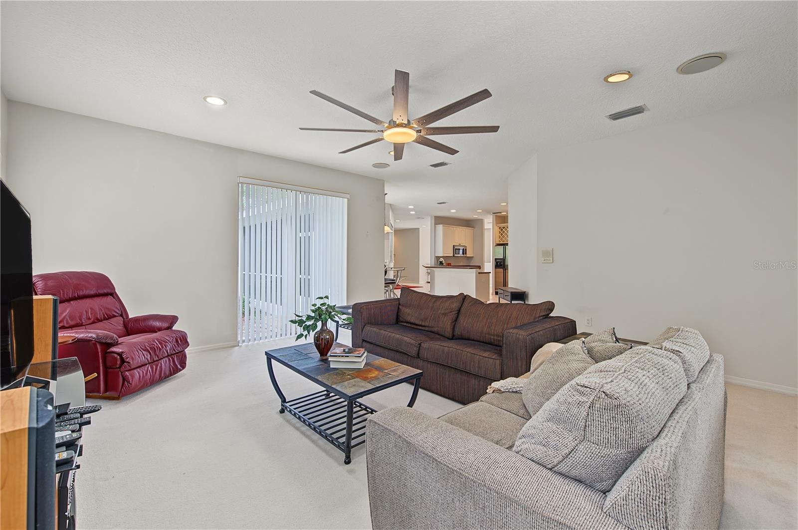 Oversized Family Room, with new ceiling fan and sliding doors to the back yard.