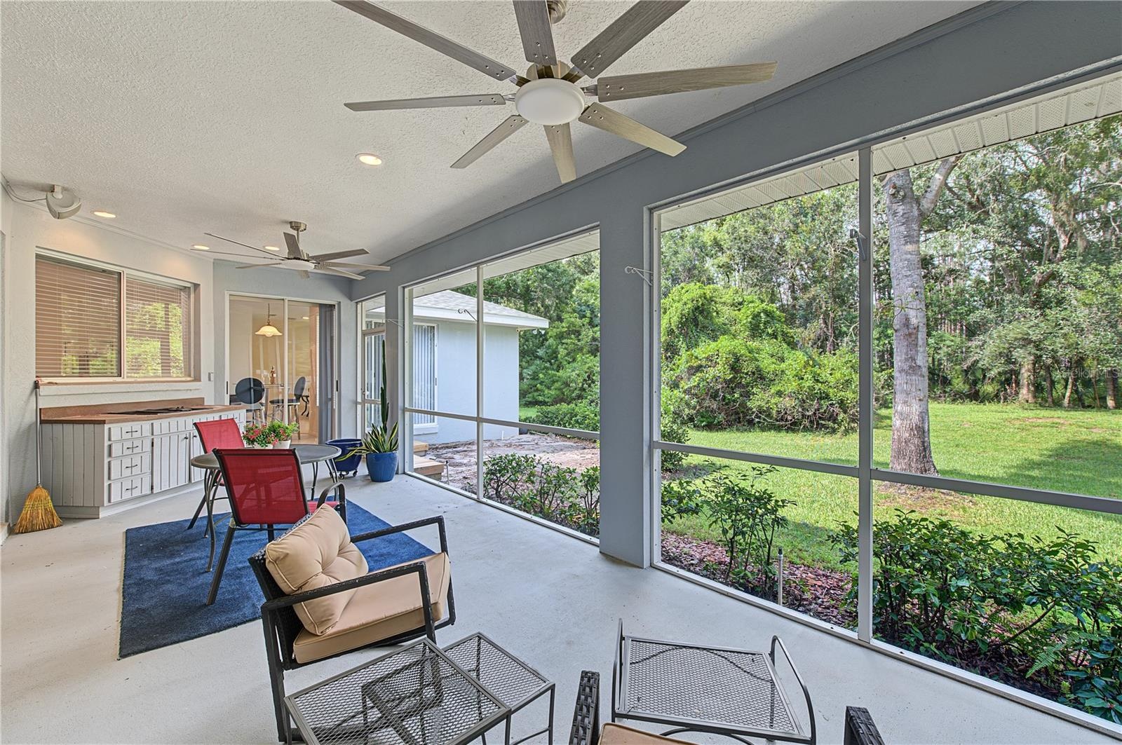 Back Porch with new ceiling fans- French doors off of the master Bedroom