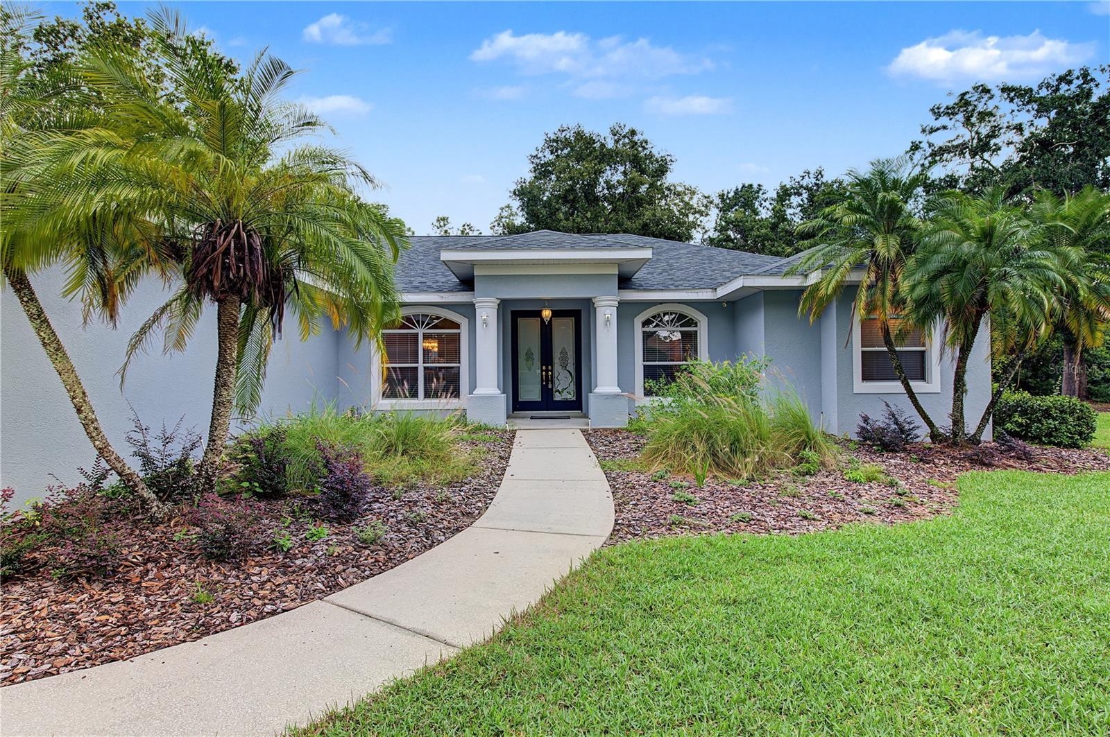 Long Front Walkway, this home offers a lot of privacy.