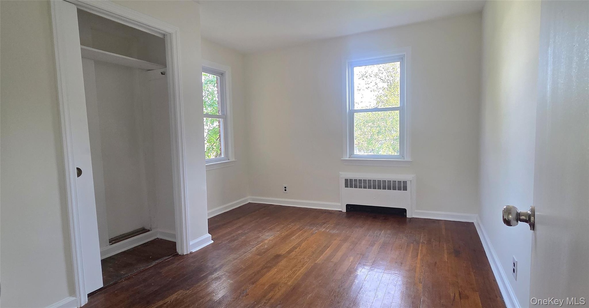 Second bedroom has hardwood flooring