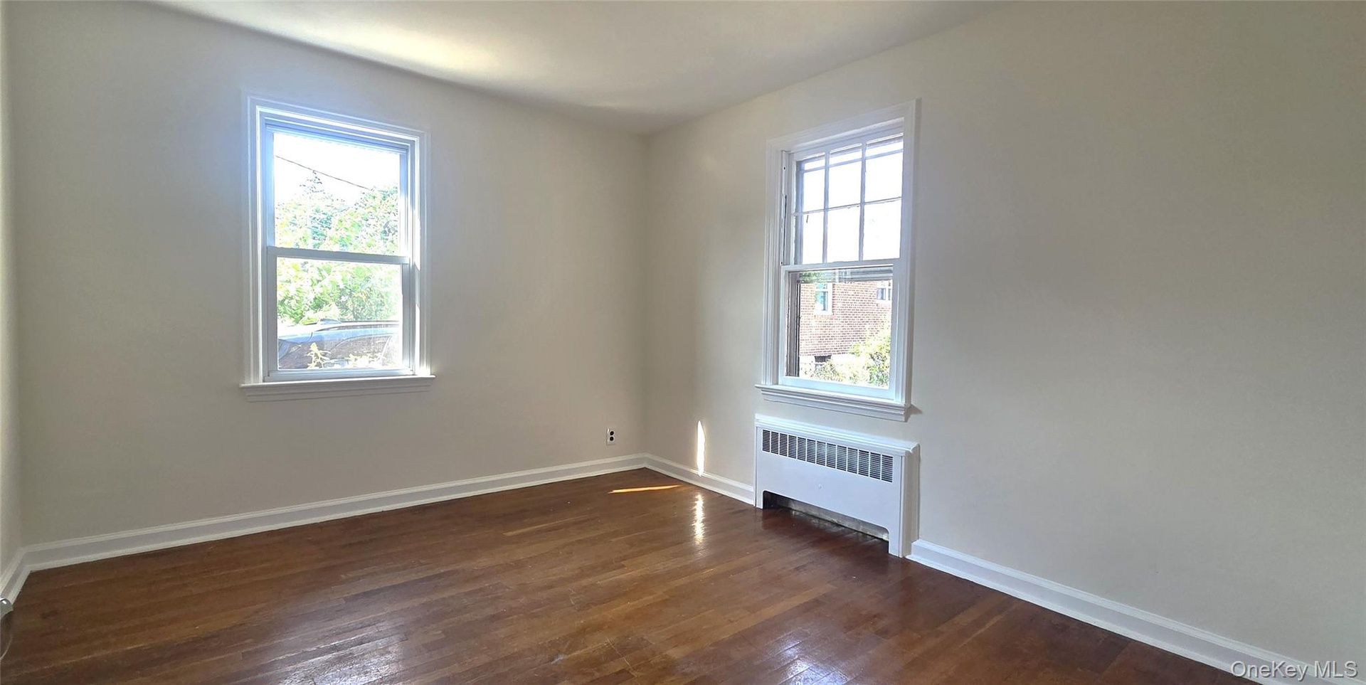 Bedroom has hardwood flooring