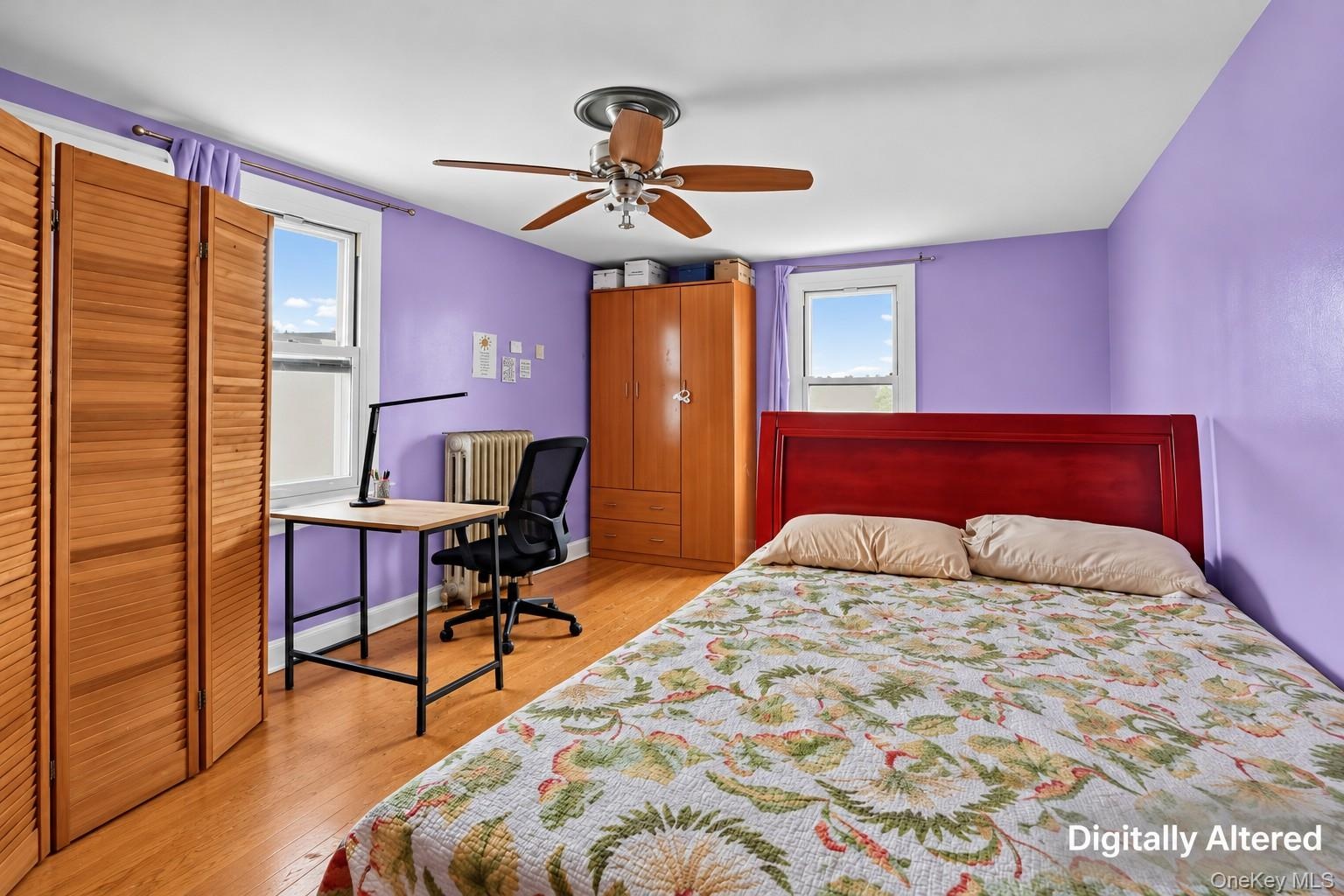 Wood-finish flooring, ceiling fan, and multiple windows