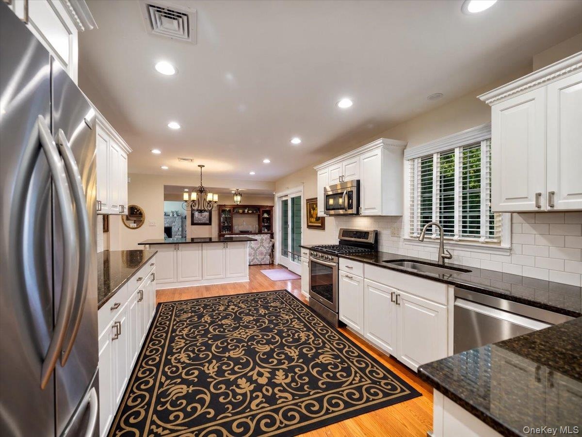 Breakfast bar adds additional cabinets and seating