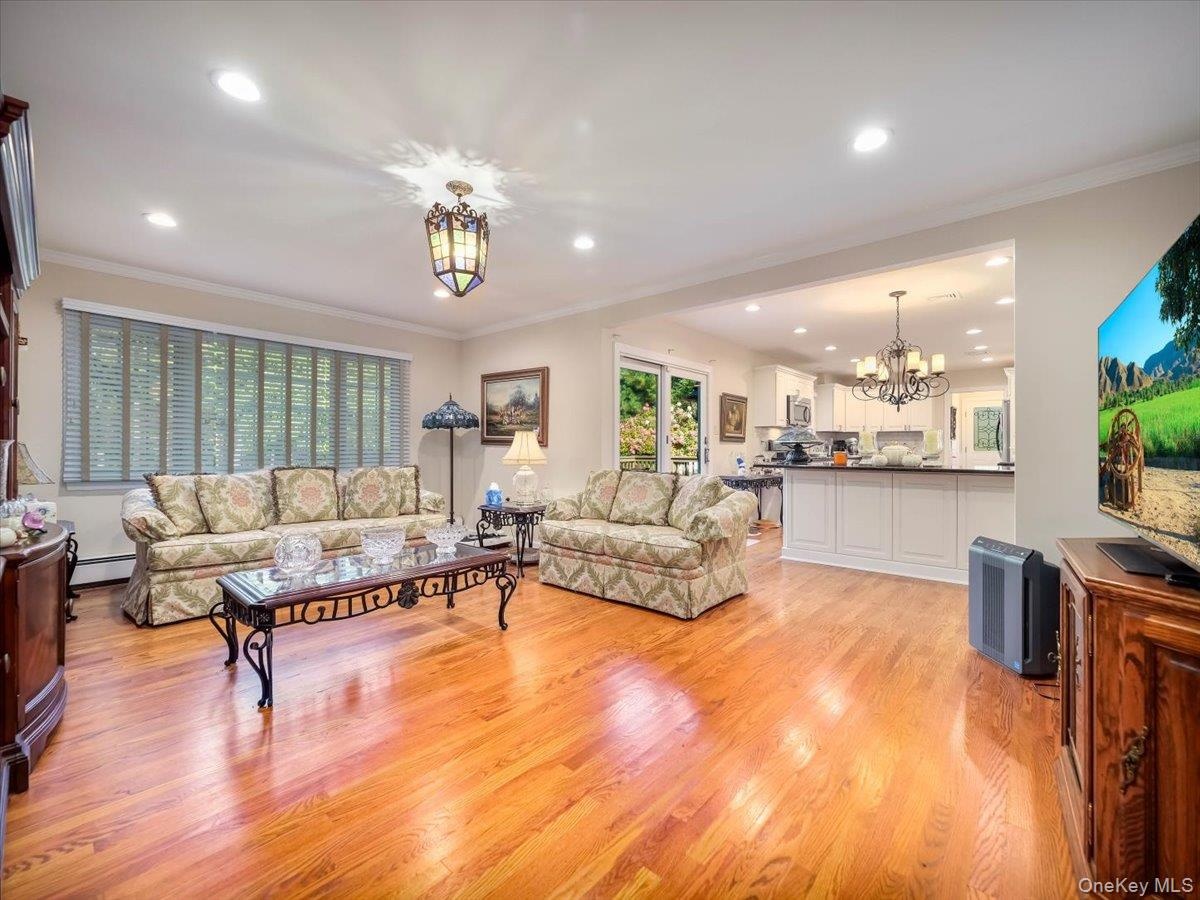 Family room with hardwood floors and recessed lighting
